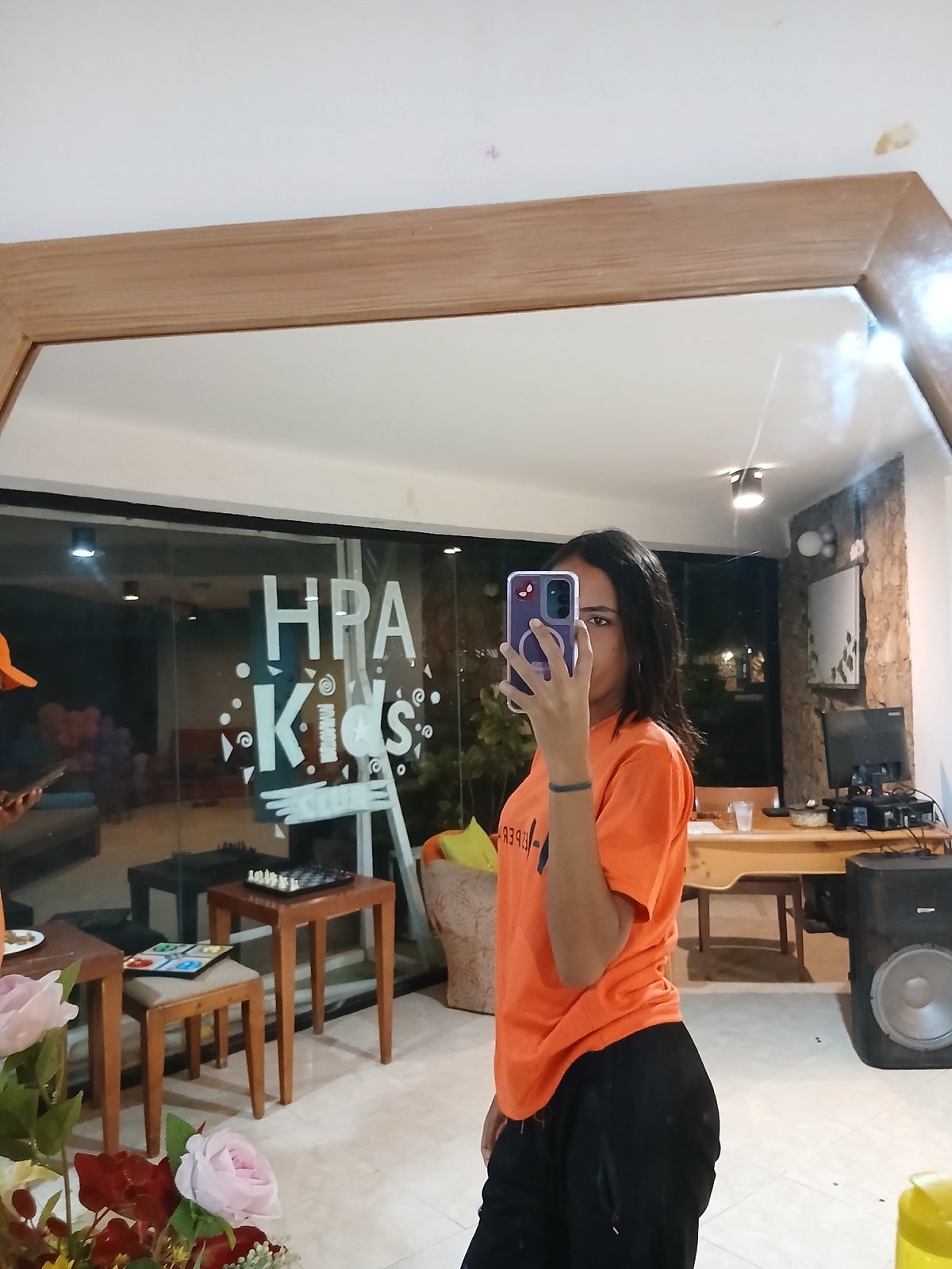 Person takes mirror selfies at Playa El Agua restaurant