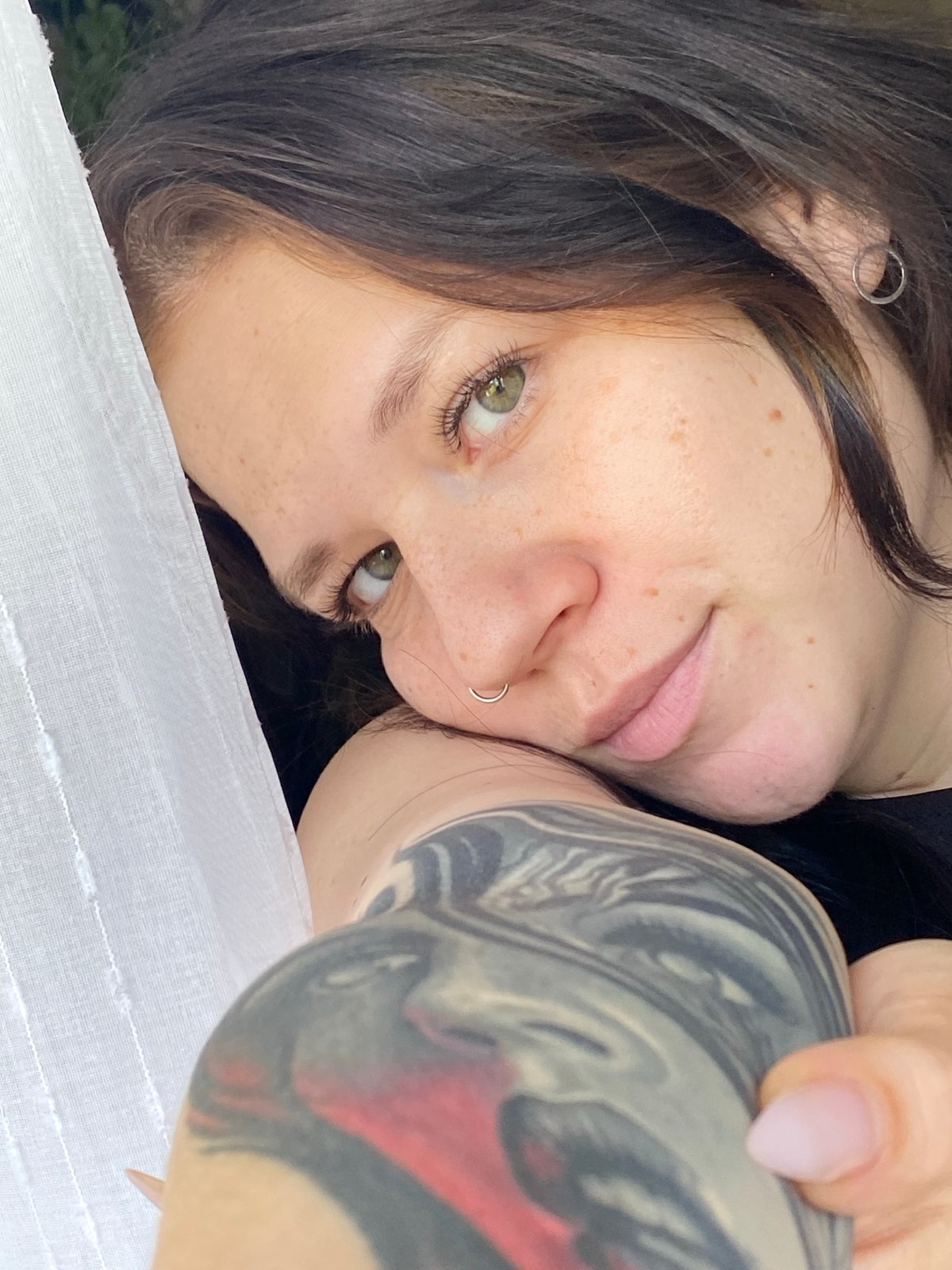 Morning photography session captures woman, plant, cat in Chaikovsky