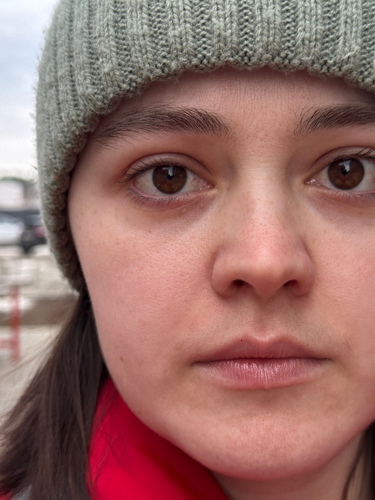 Woman takes selfies with baby near apartment building in Izhevsk