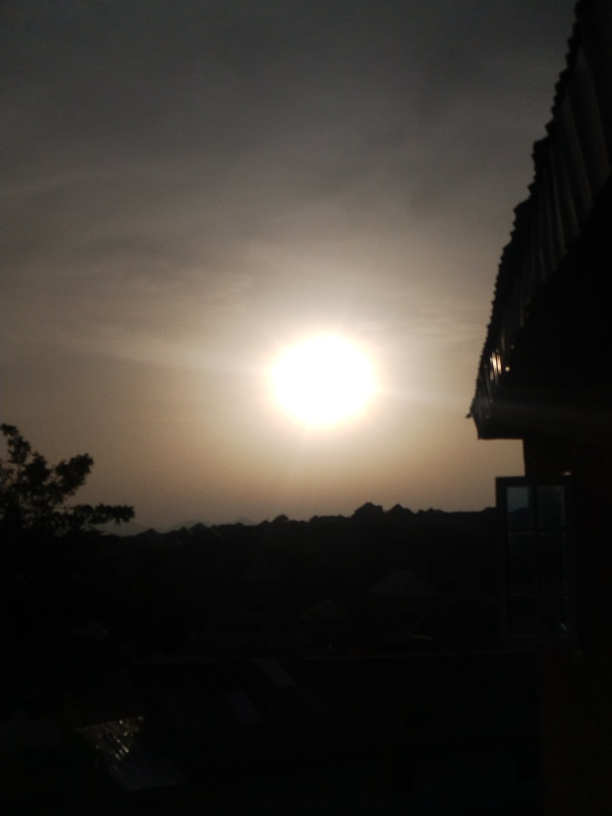 Bright sunrise observed over Jos, Nigeria rooftops