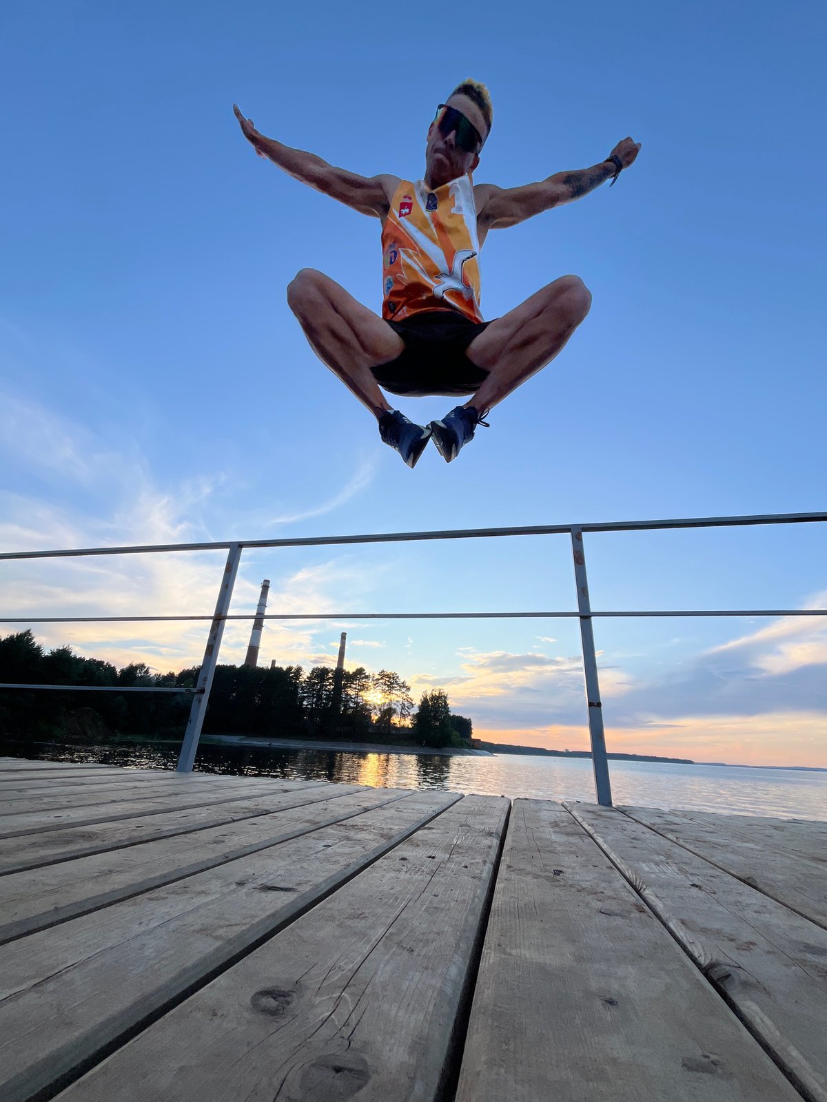 Sunset acrobatics and hang time on a Kama River pier