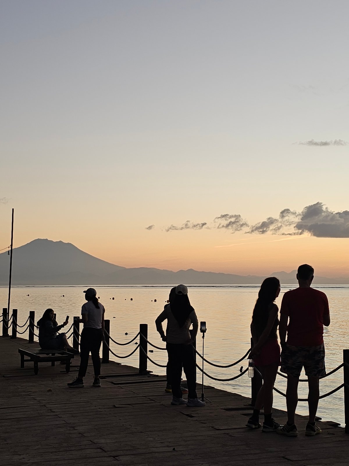 Evening crowds gather at Denpasar waterfront for sunset viewing