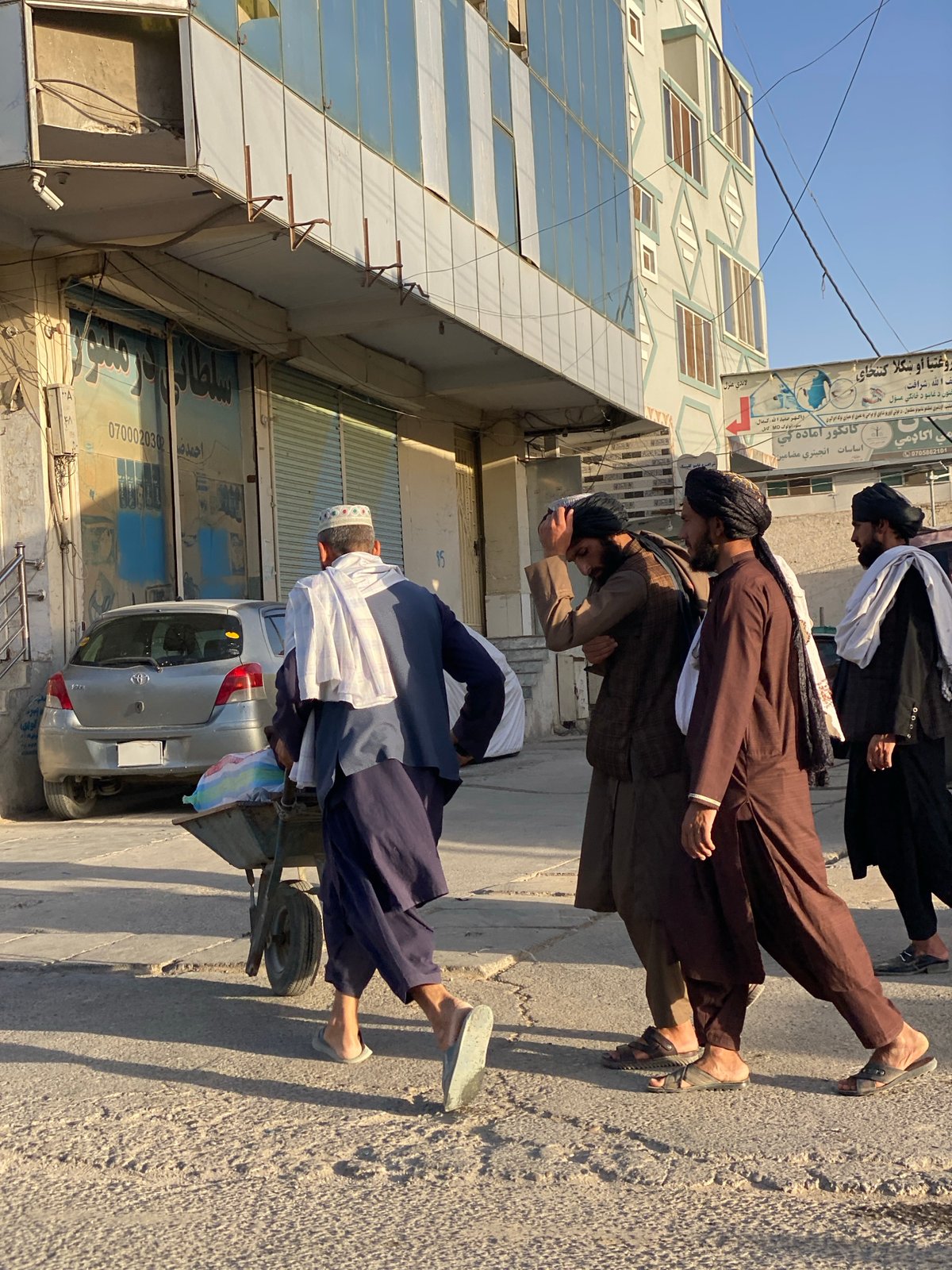 Daily life captured across Kandahar streets during sunny afternoon