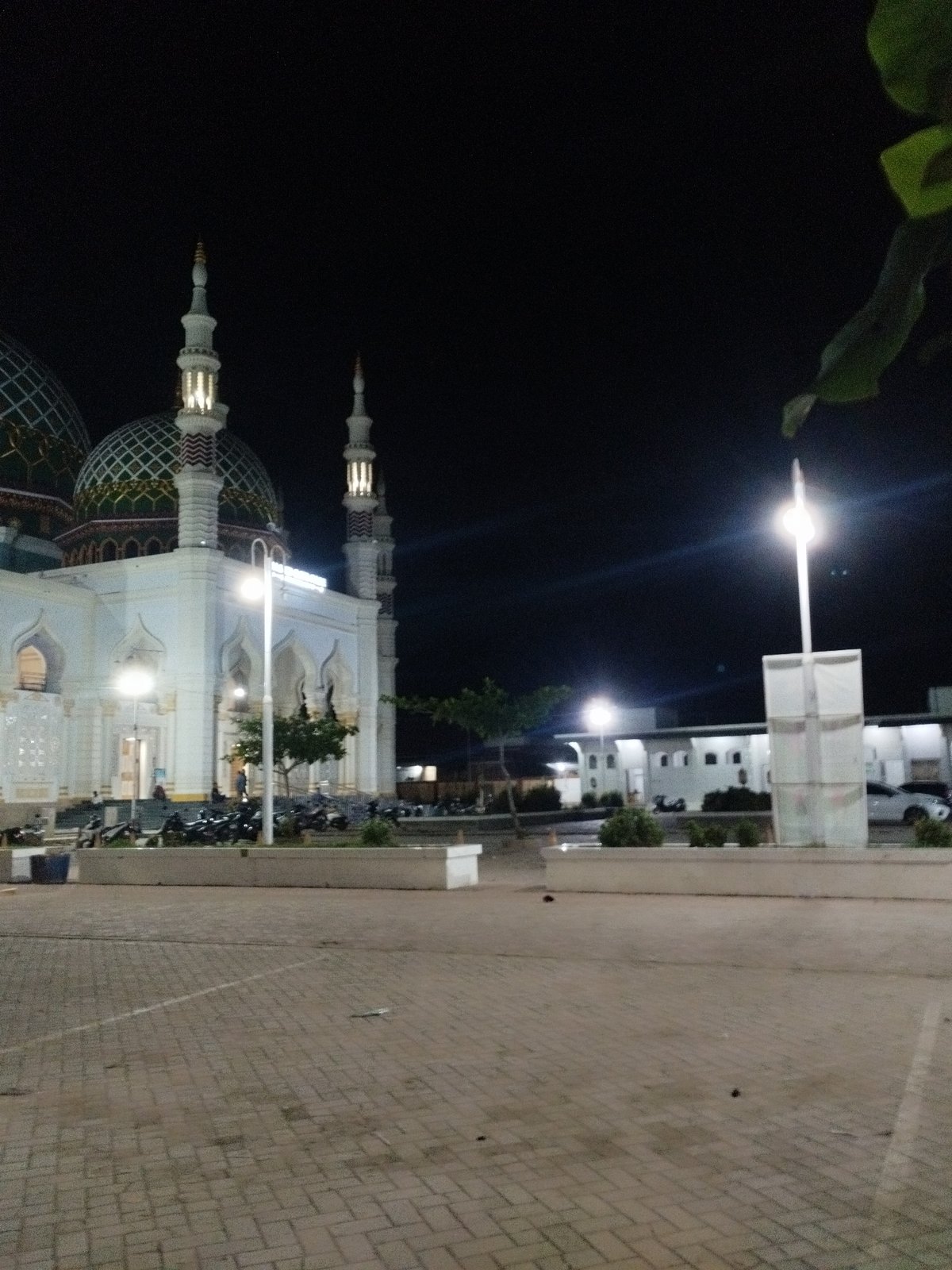 Nighttime illumination of Masjid Baiturrahim mosque documented in Indonesia