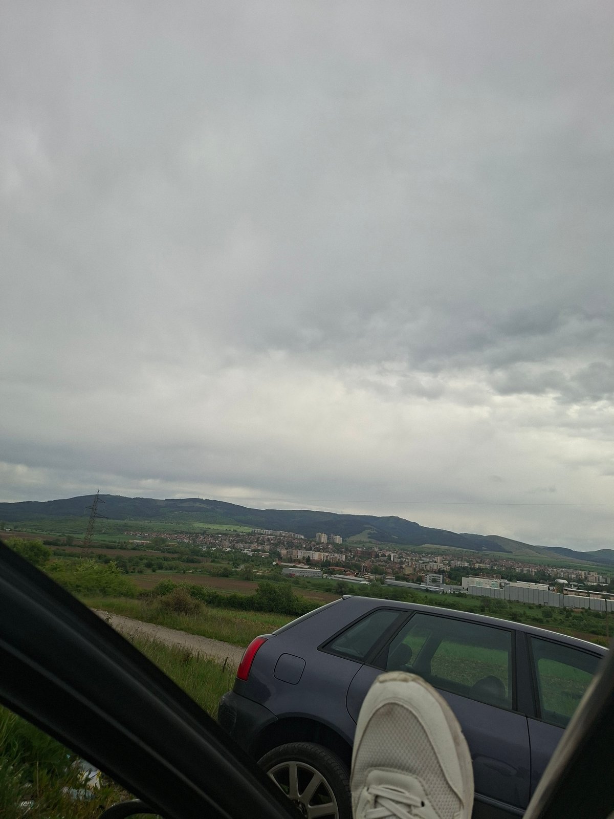 Traveler stops in rural Bulgaria, documents mountain views