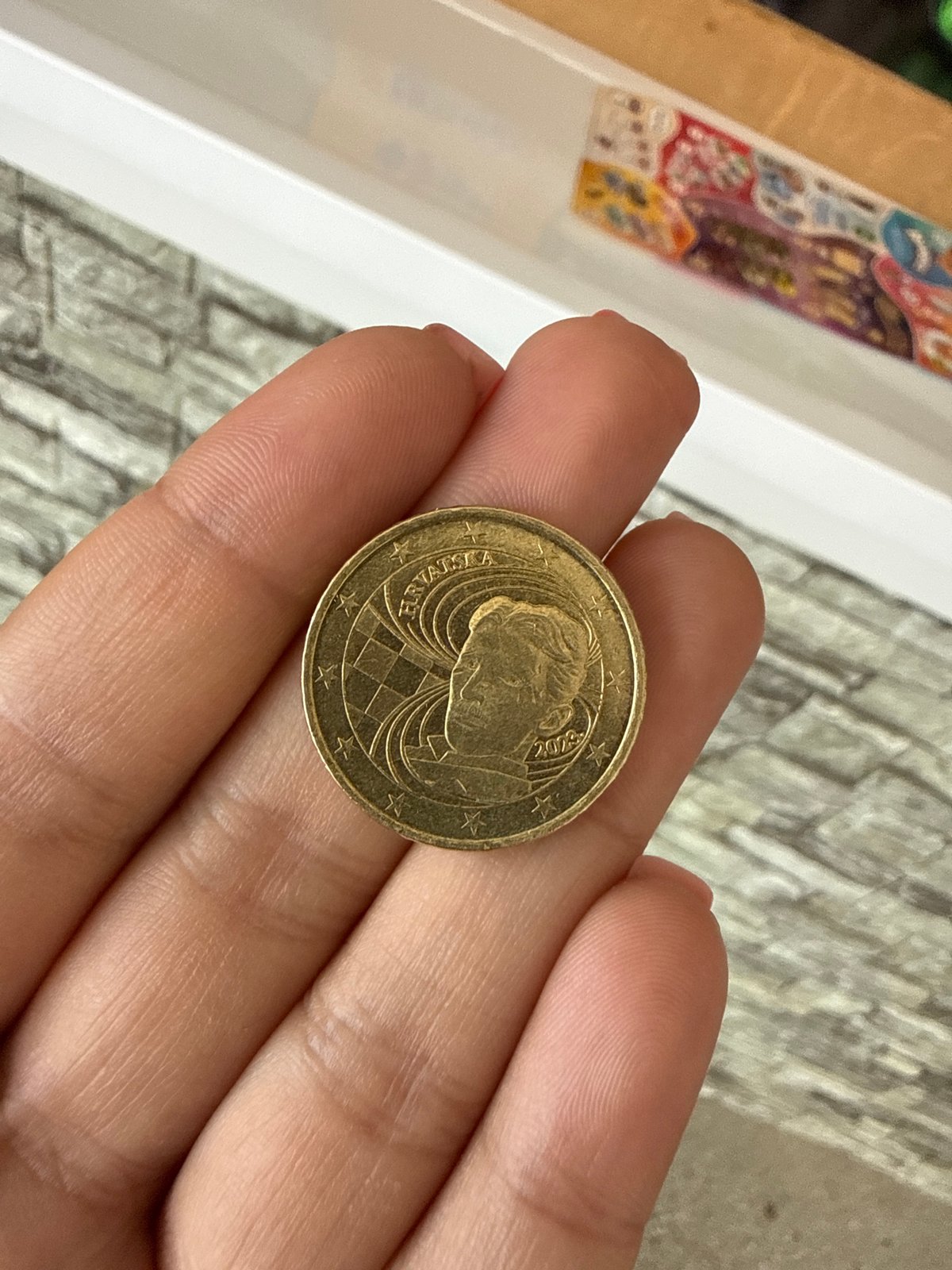 Close-up of a Croatian gold coin with classic design details