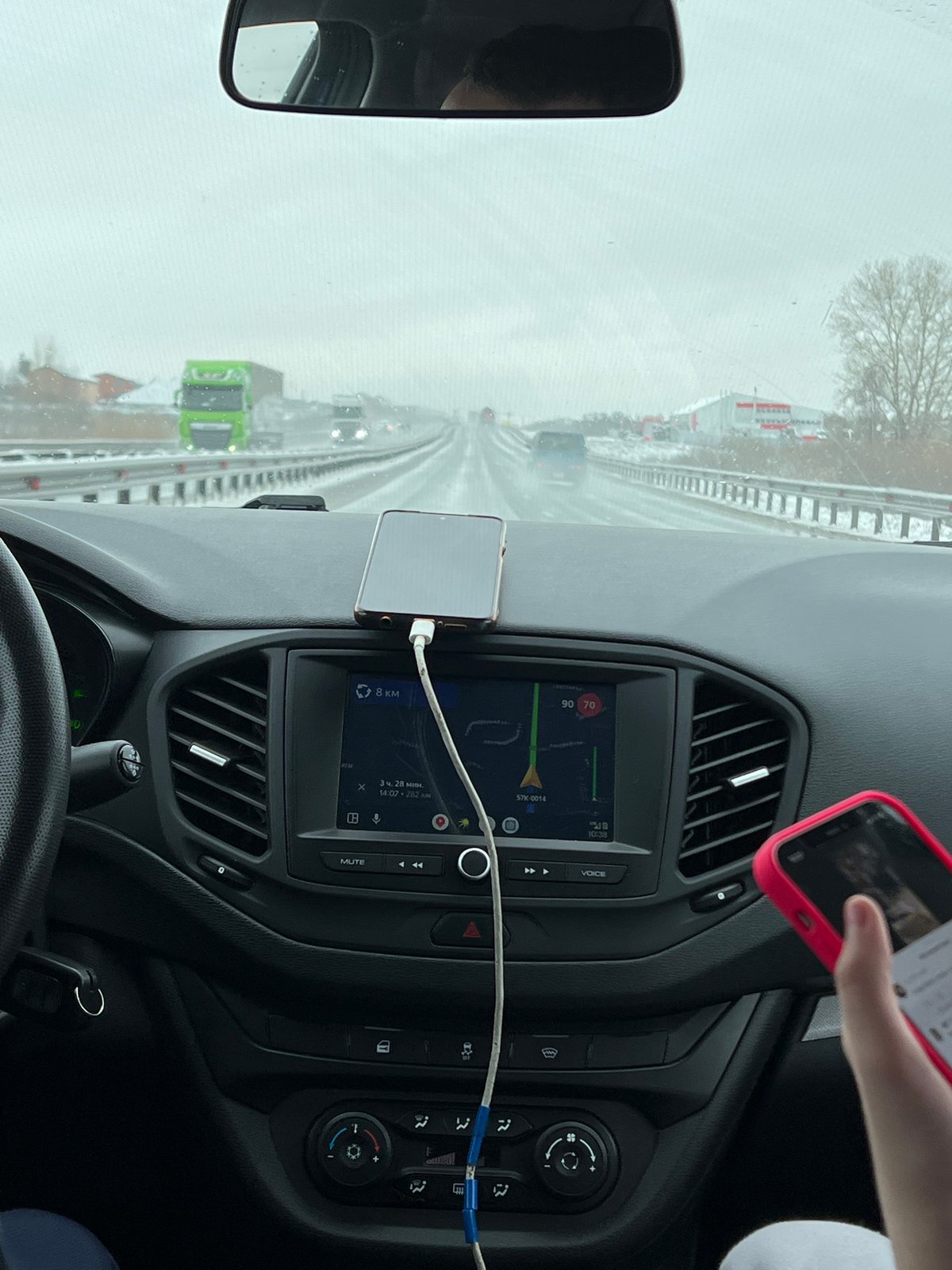 Driver navigates wet highway in Kitsjanovo, Russia