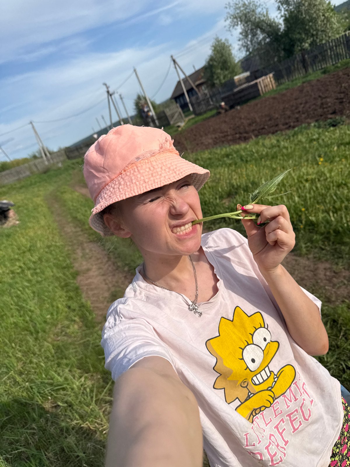 Family enjoys outdoor playtime in rural Russian village
