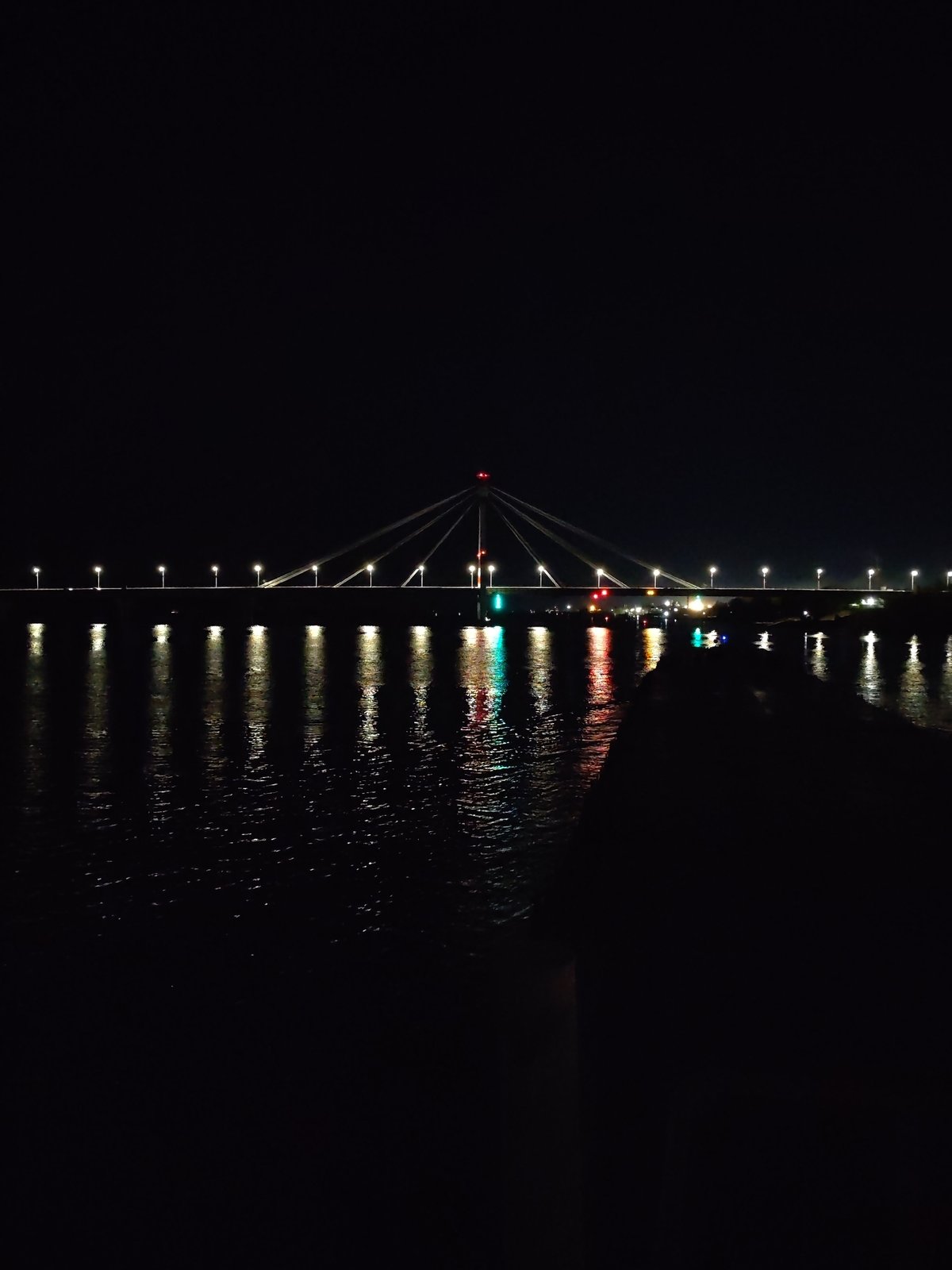 Nighttime scenes captured in Cherepovets show illuminated bridge, Ferris wheel