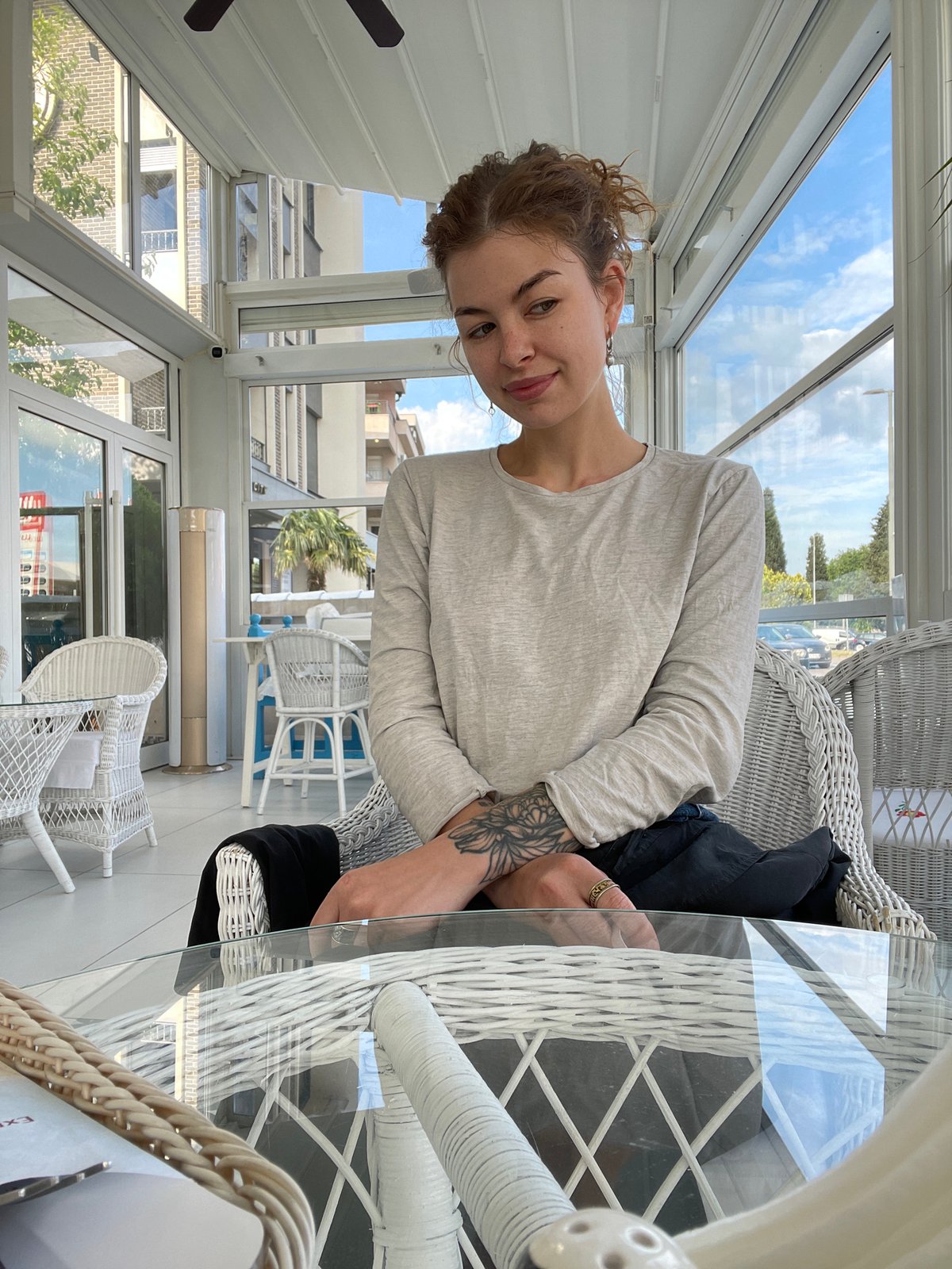 Woman enjoys early morning cafe visit in Podgorica
