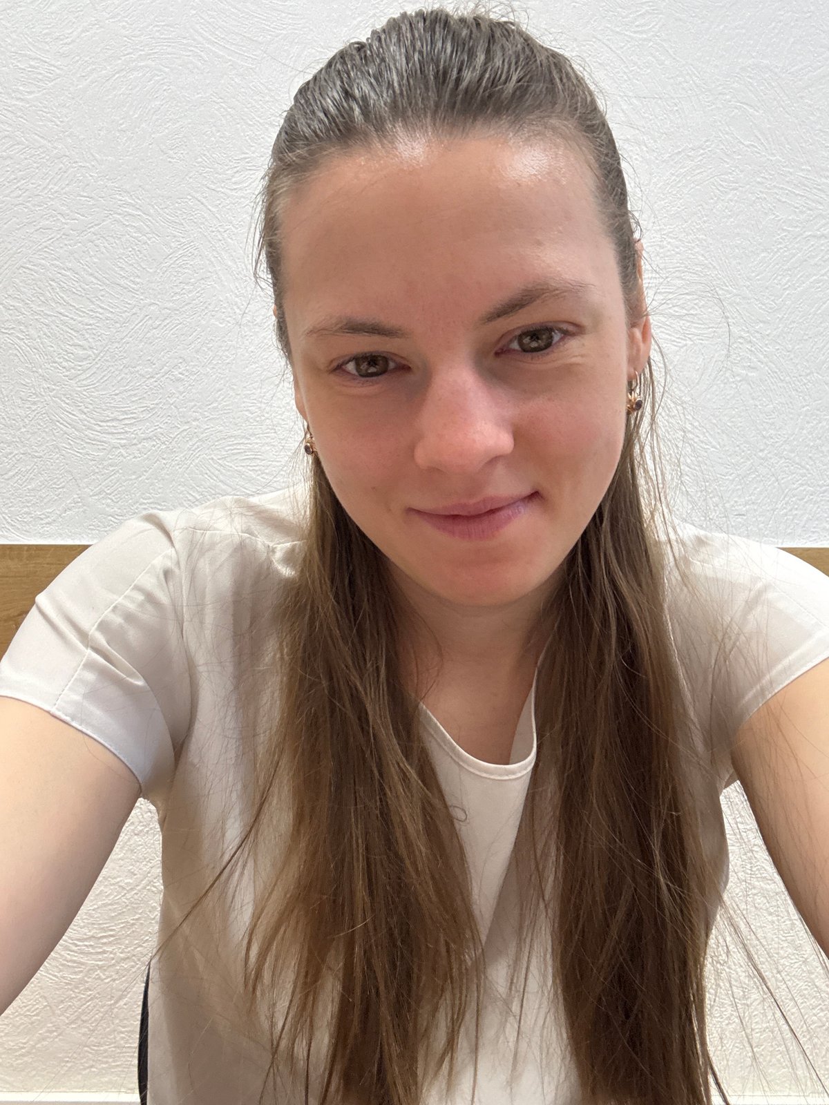 Woman photographed indoors in Chaikovsky, Russia early morning