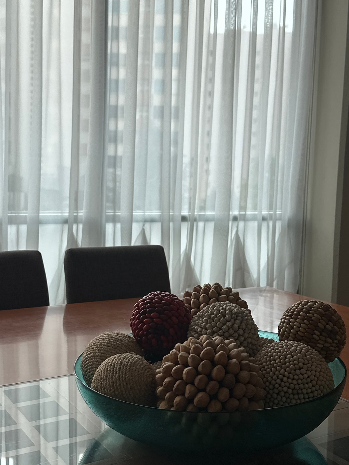 Decorative vase with colored balls observed on table in Mexico