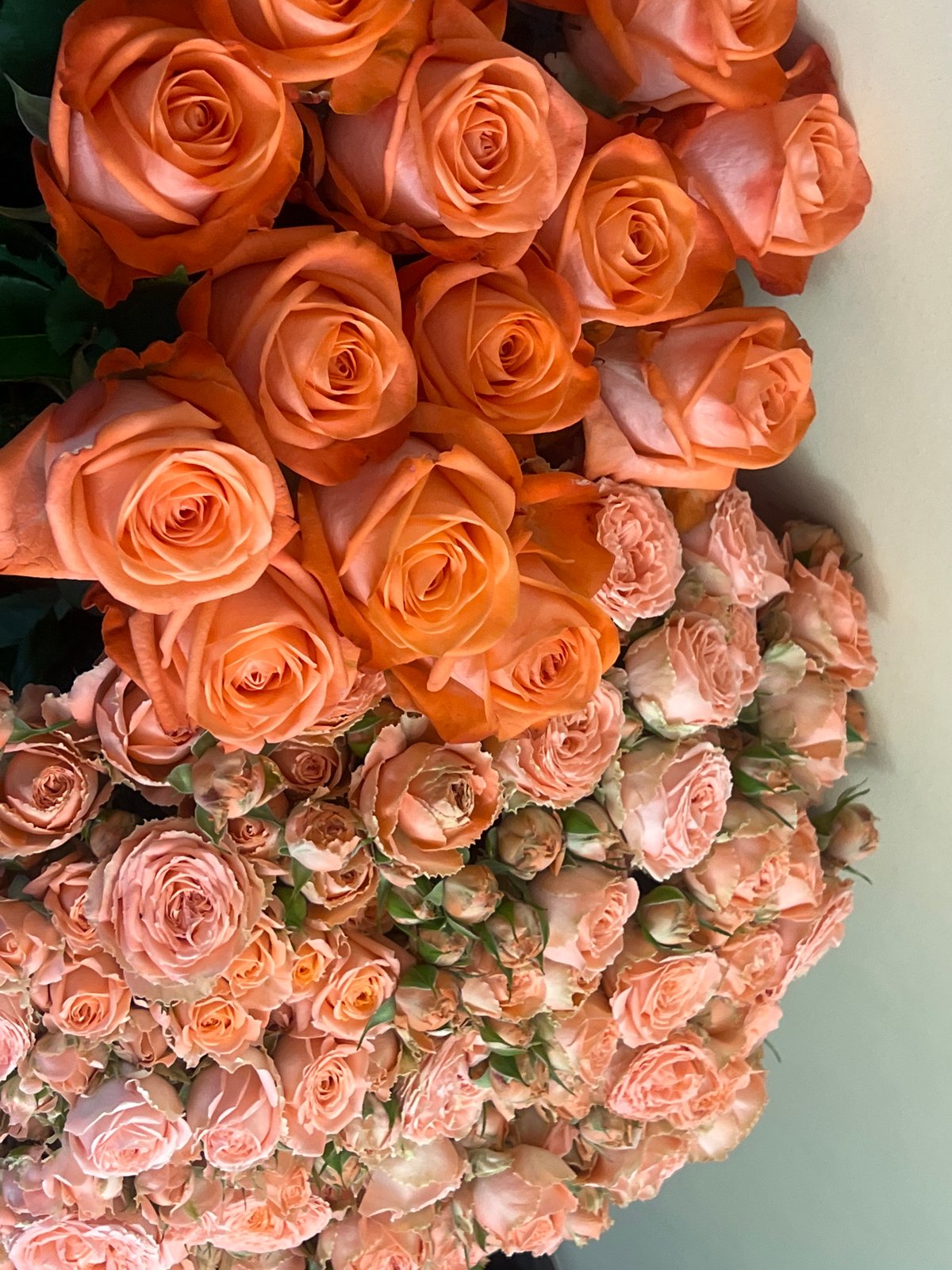Rose arrangement displayed in Yerevan features orange and peach blooms