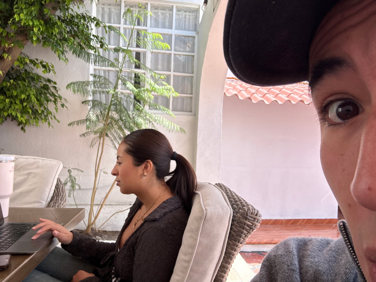 Casual outdoor gathering with laptop work documented in Puebla