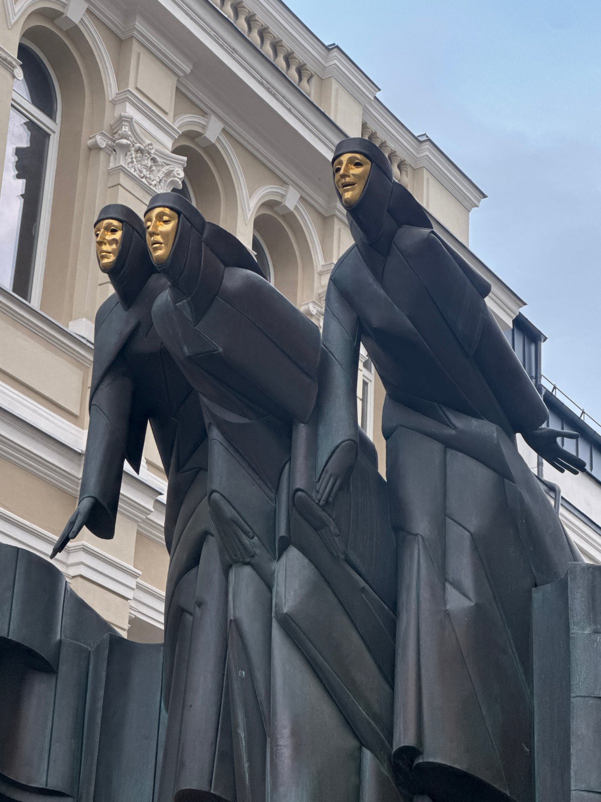 Bronze sculpture with golden faces spotted at Vilnius theatre