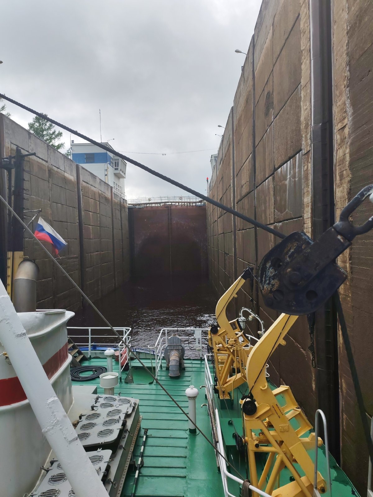 Barge transits Volga-Baltic Waterway lock in Devyatiny, Russia