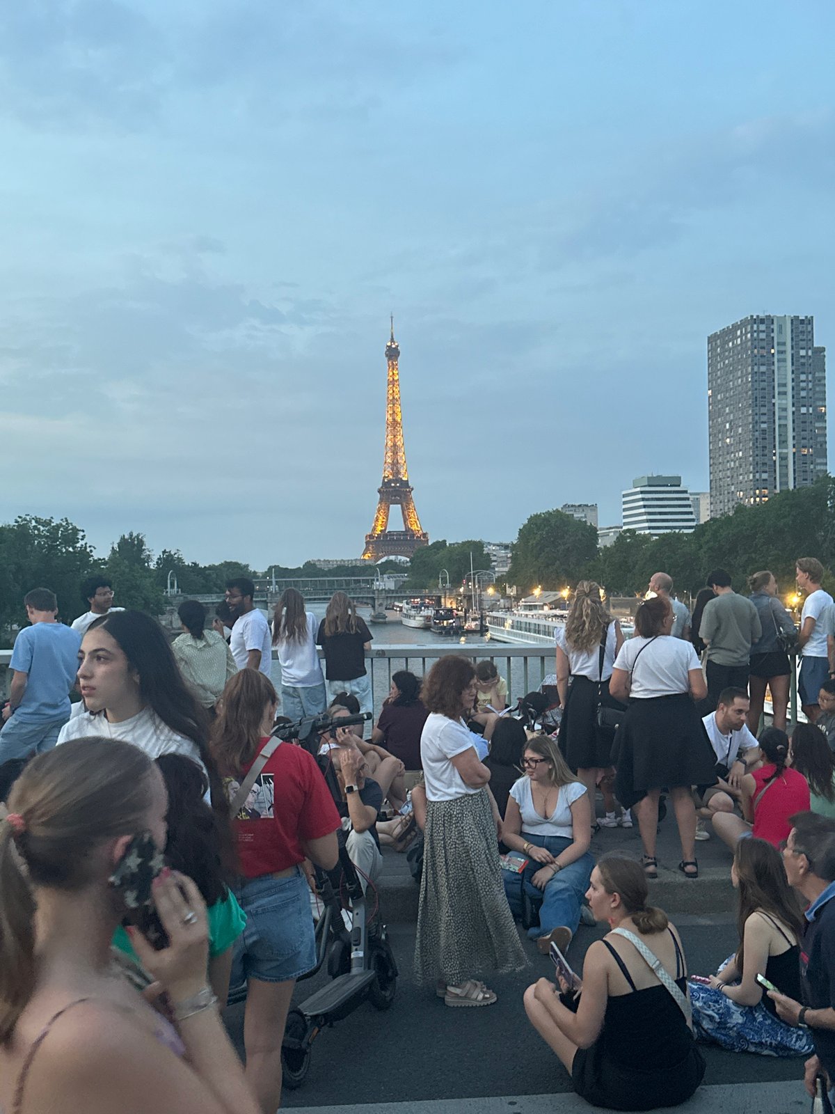 Paris crowds gather along the Seine on Bastille Day eve