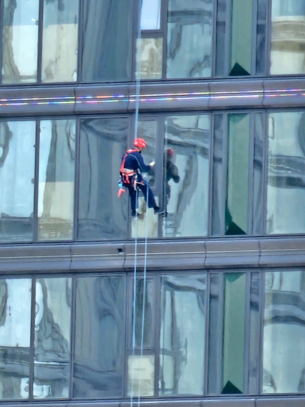 High-rise window cleaning on a Moscow glass skyscraper