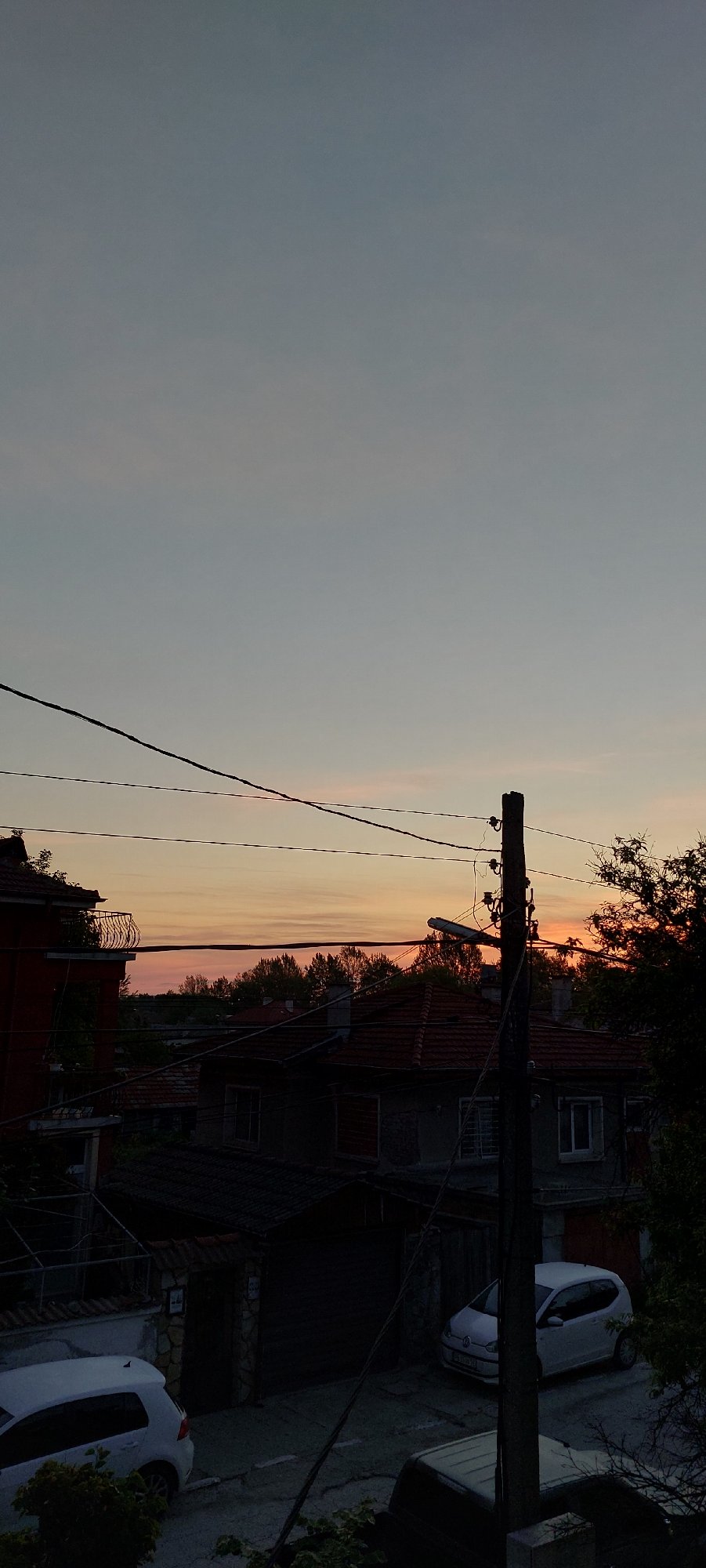 Evening sky colors captured over Yagodovo village rooftops