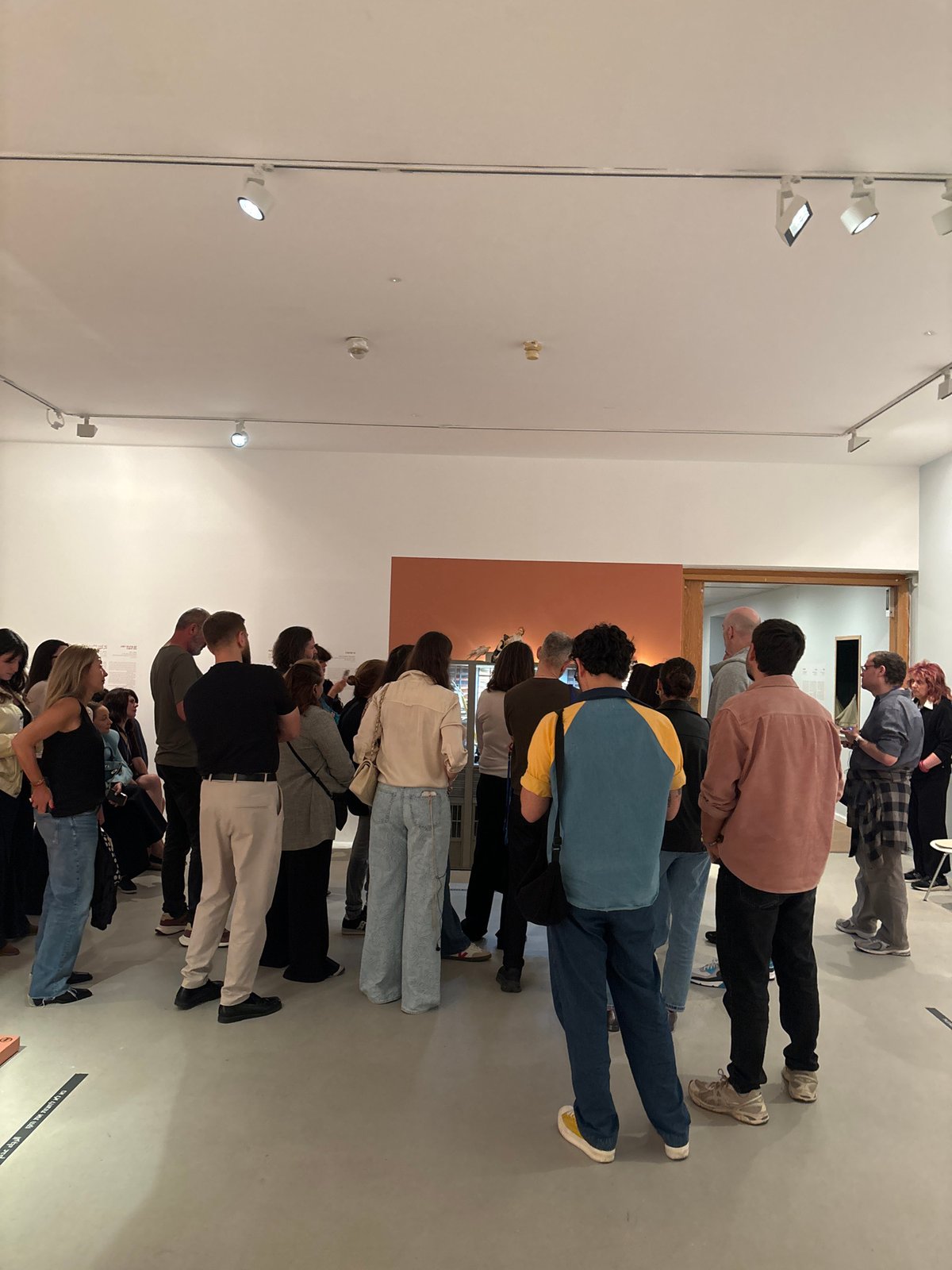 Art gallery visitors view Tel Aviv building facade exhibit