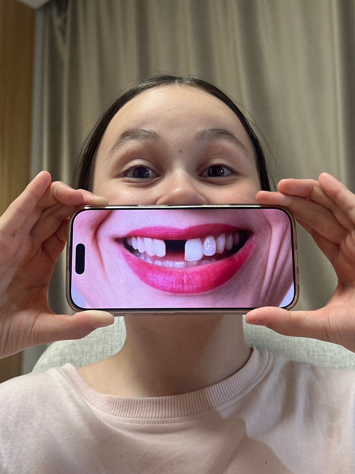 Young person takes smartphone selfies in Votkinsk, Russia