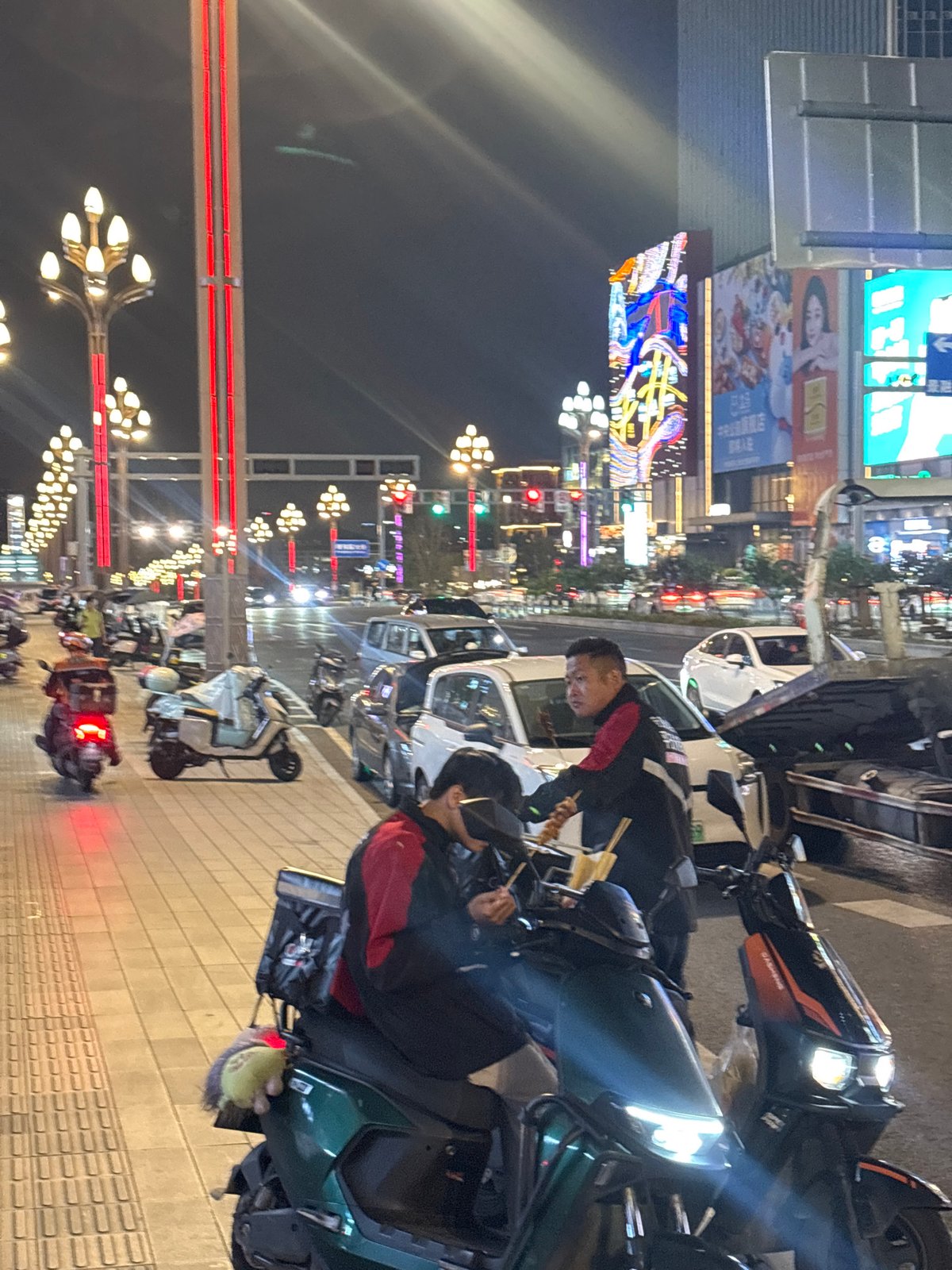 Street food scene captured in nighttime Liangjiang, China