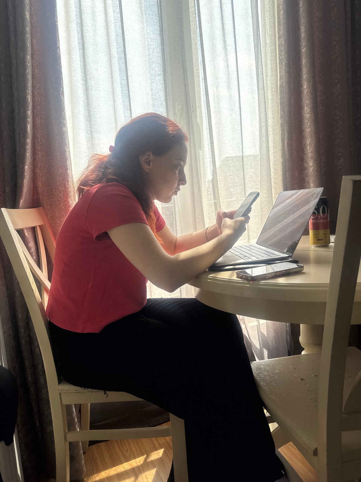 Women relax with phones on couches in Tbilisi homes