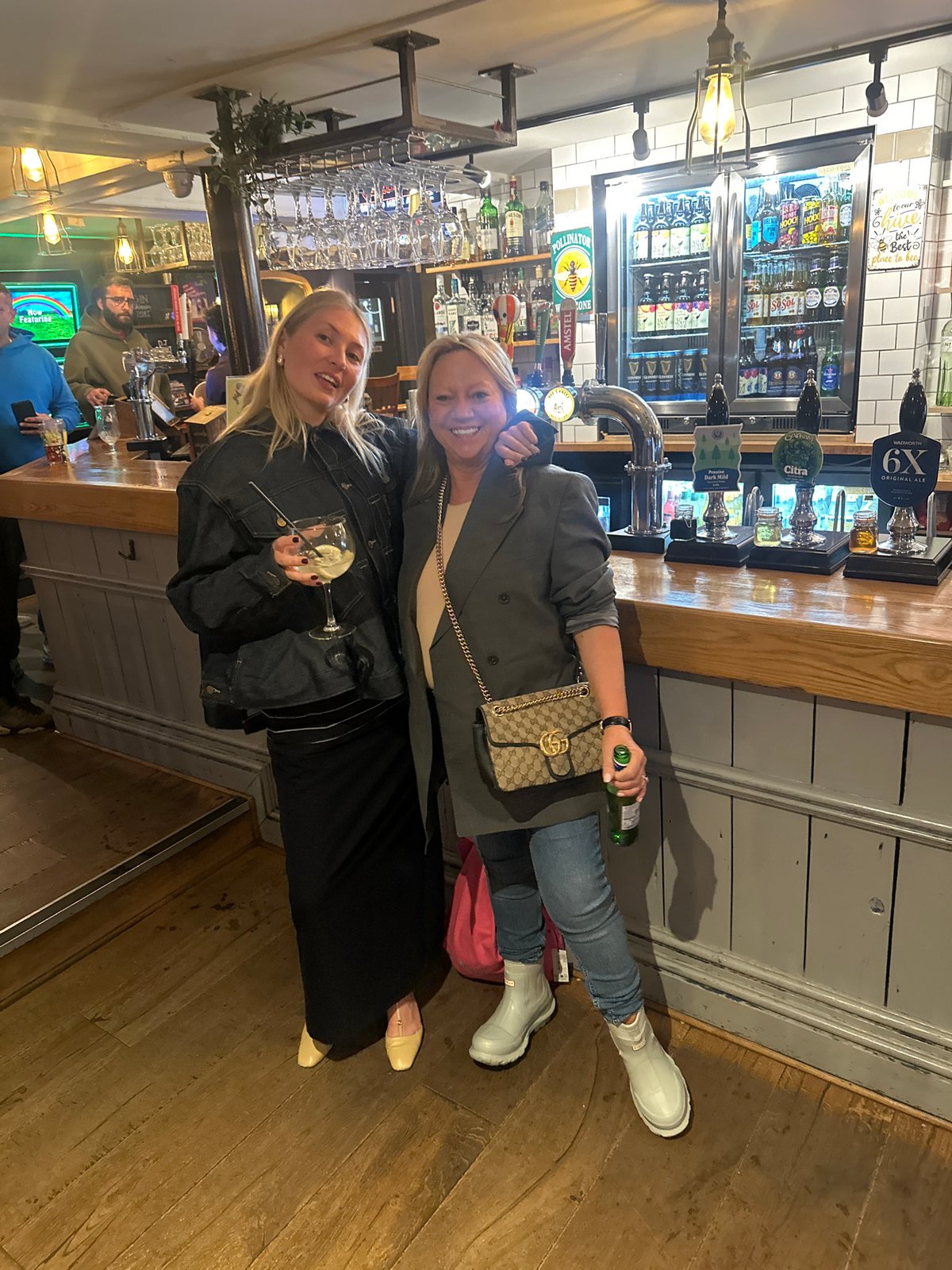 Two women share drinks at St Albans pub