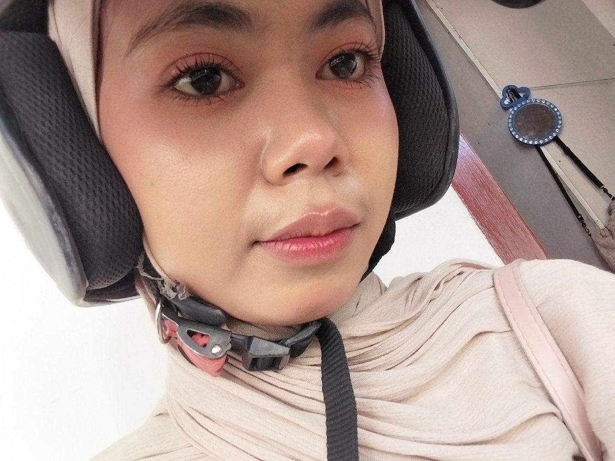Selfie series in Tibojong and Watampone, hijab and helmet in frame
