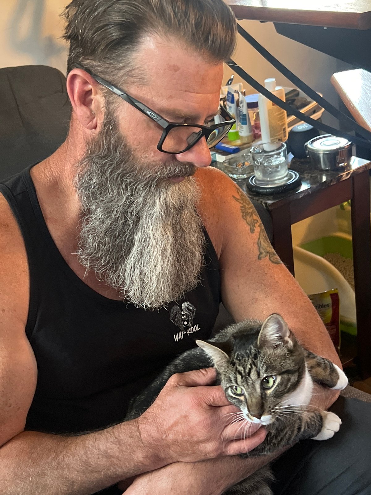 Man with cat photographed wearing motivational shirt in Newburgh