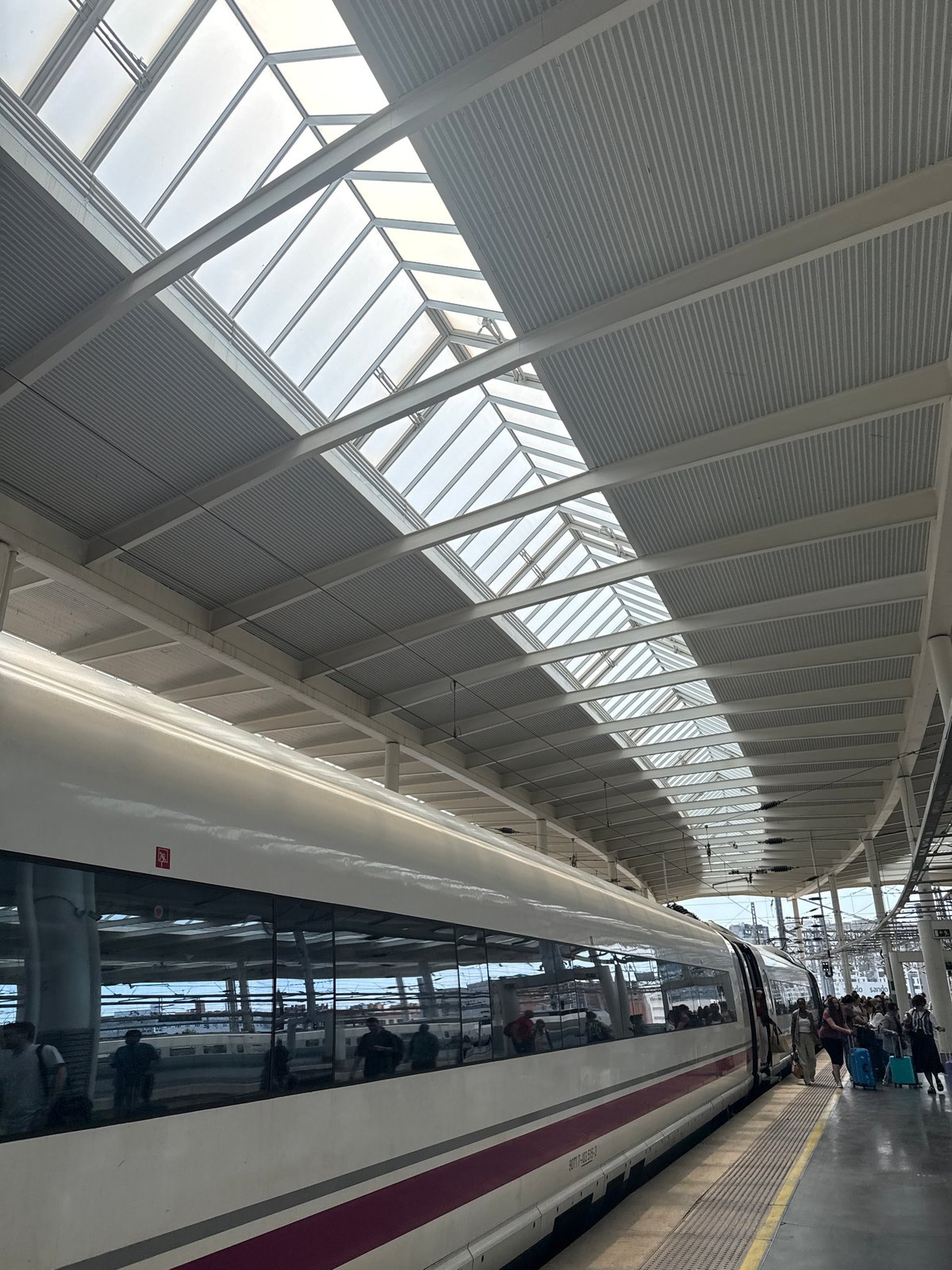 Passengers board train at Madrid station Saturday morning