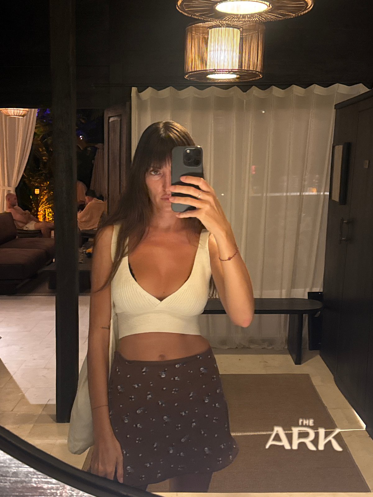 Woman takes mirror selfies, DJ performs in Bali