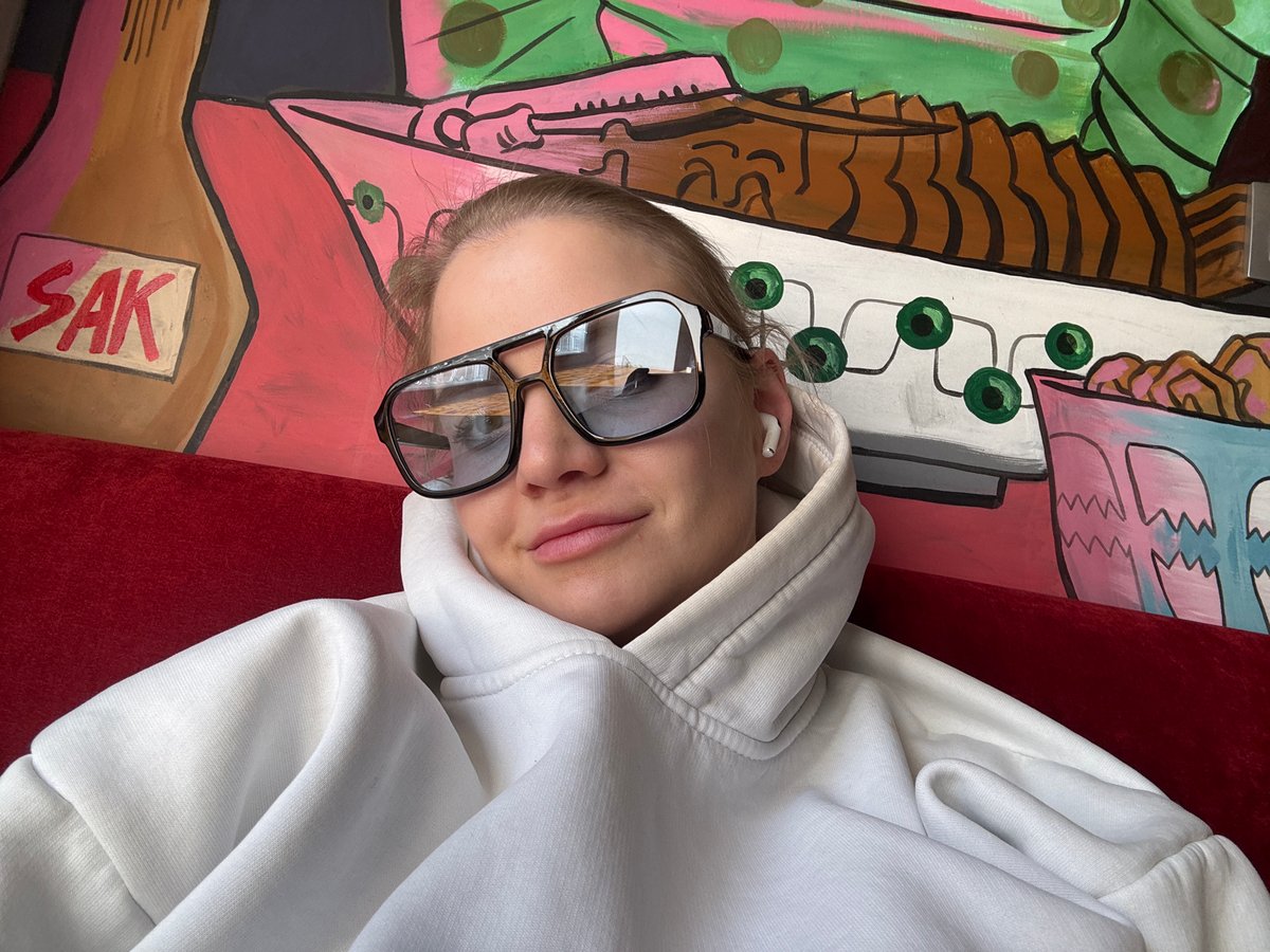 Person documents restaurant visit with selfies in Saint Petersburg