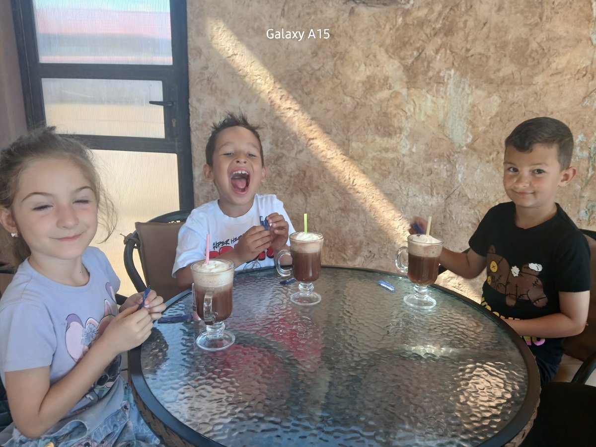 Children share morning drinks at Bulgaria cafe