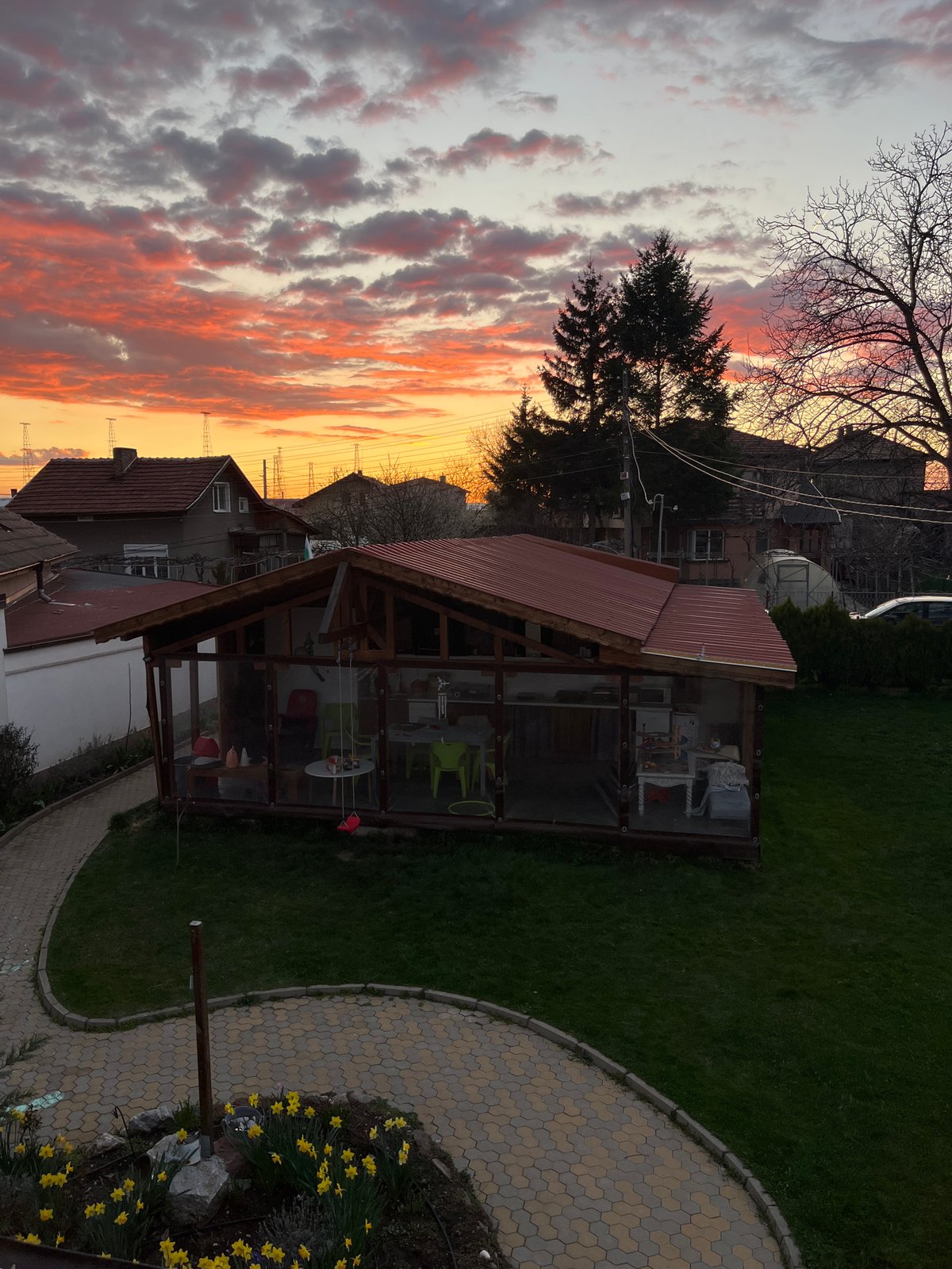Spring afternoon captured in Kostinbrod: sunset, blossoms, child playing