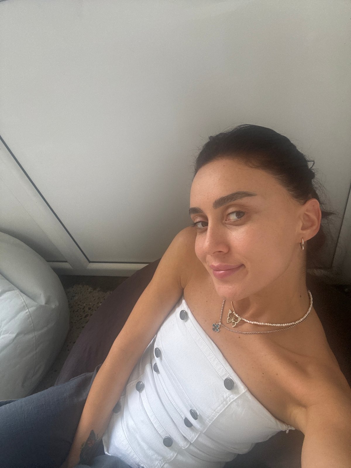 Casual indoor portrait in a Tbilisi residential setting.