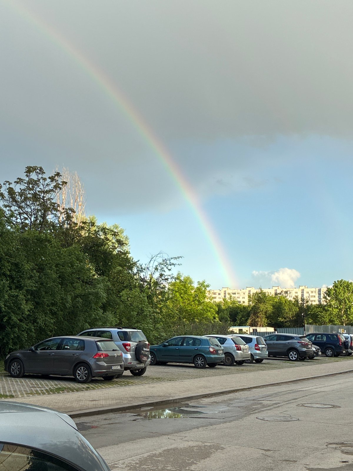 Rainbow spotted over Sofia street amid cloudy skies