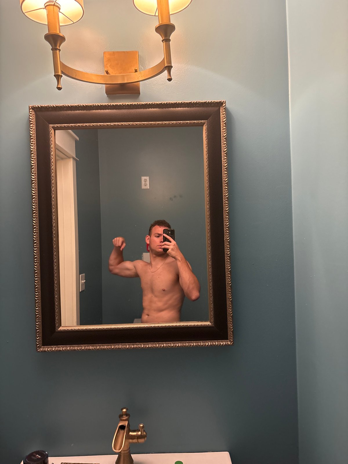 Bathroom mirror flex selfie in Panama City Beach
