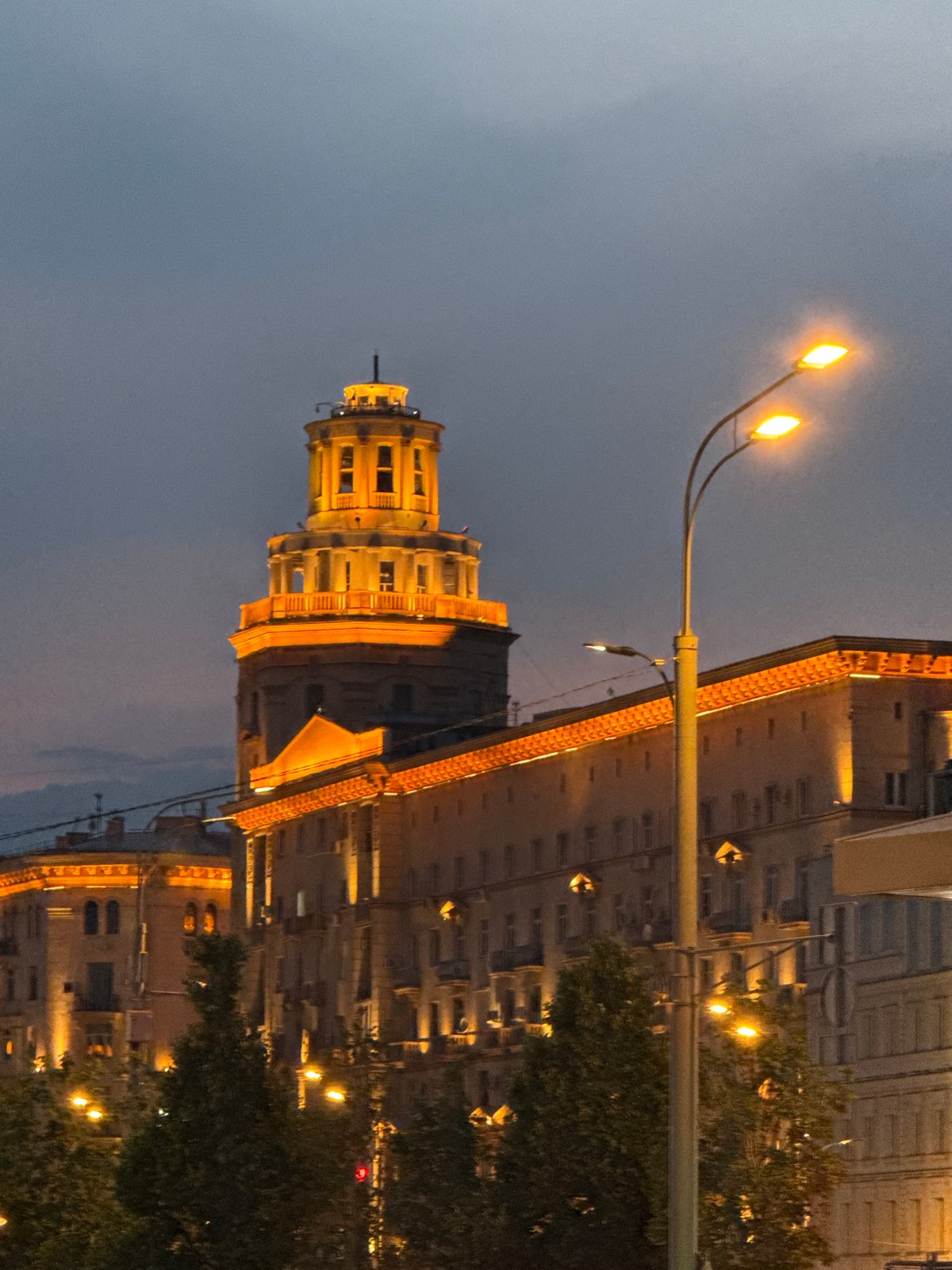 Child dances near illuminated Moscow building as crowds gather