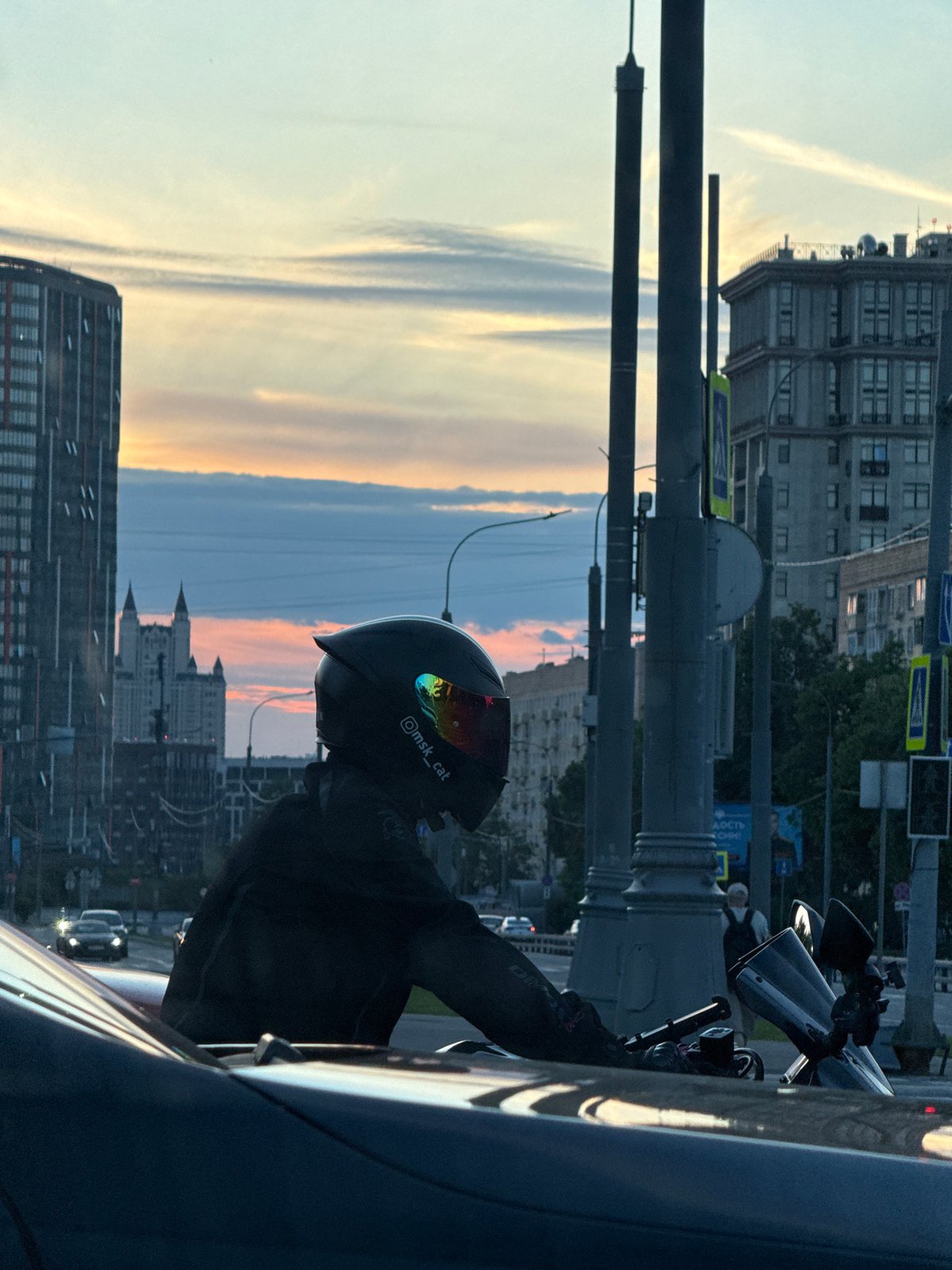 Motorcycle stop near Moscow State University at dusk