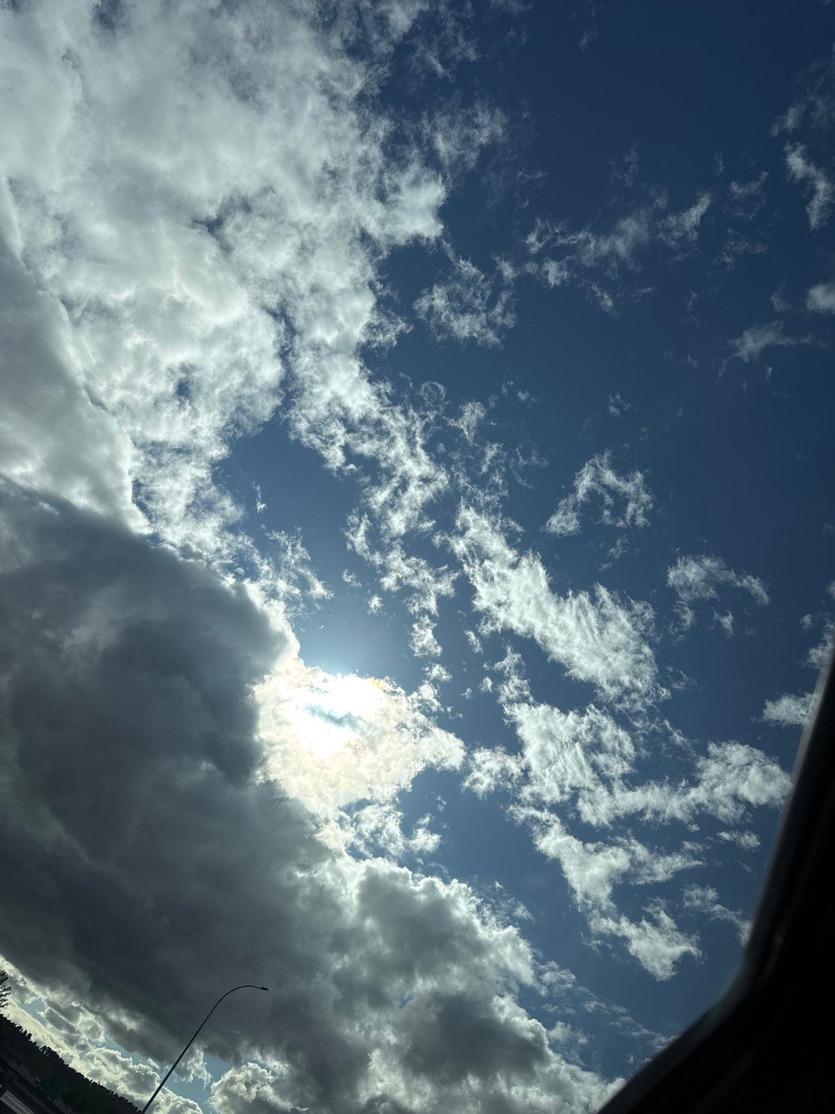 Highway journey documented through sky and road views