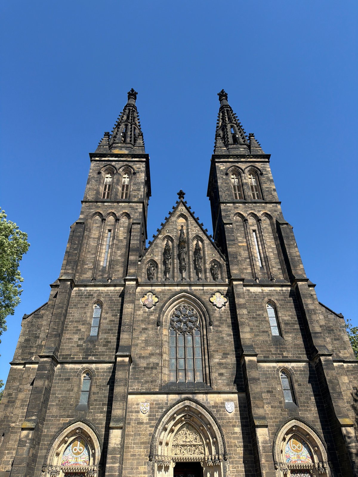 Gothic spires and river views across sunny Prague