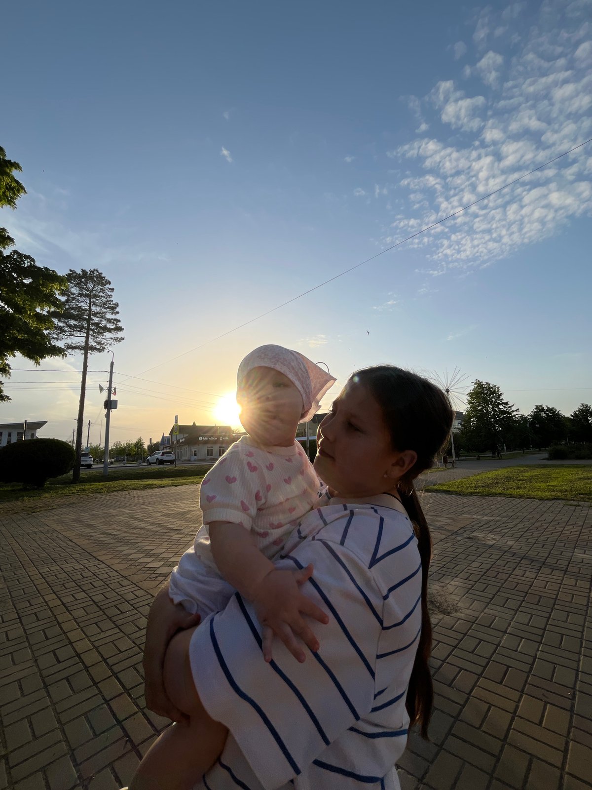 Family afternoon stroll documented in Novopokrovskaya, Russia