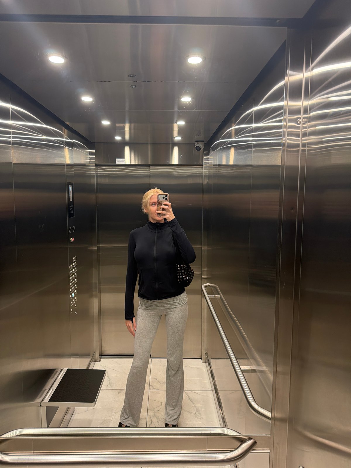 Woman takes elevator selfie in Belgrade