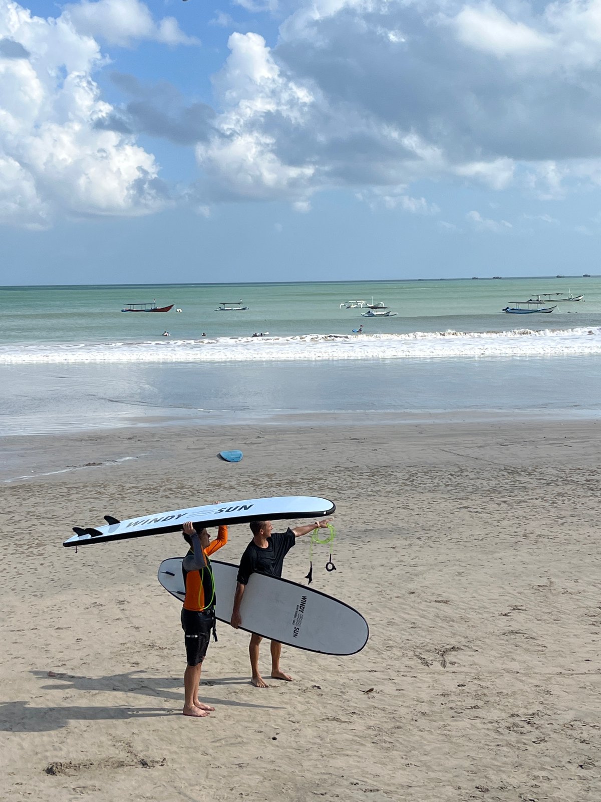 Surf groups hit the beach at Kuta Selatan
