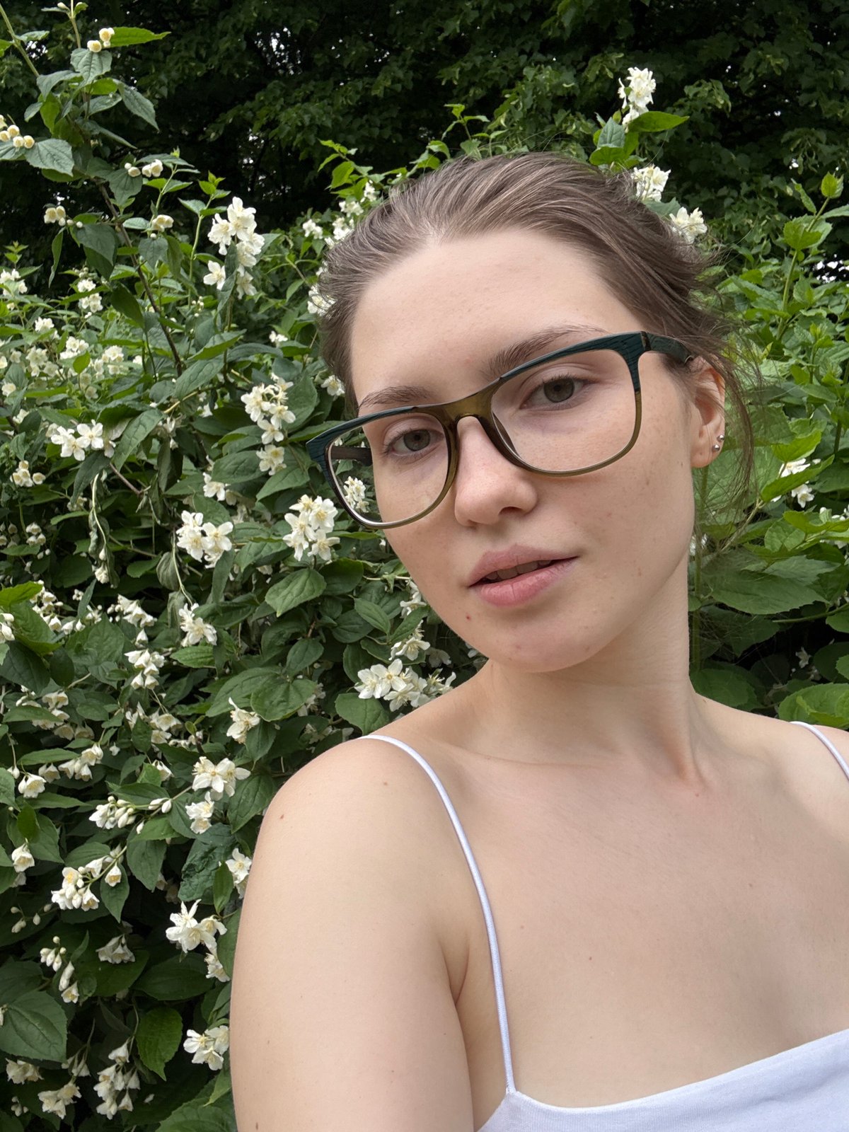 Woman documents casual park visit with selfies in Saint Petersburg