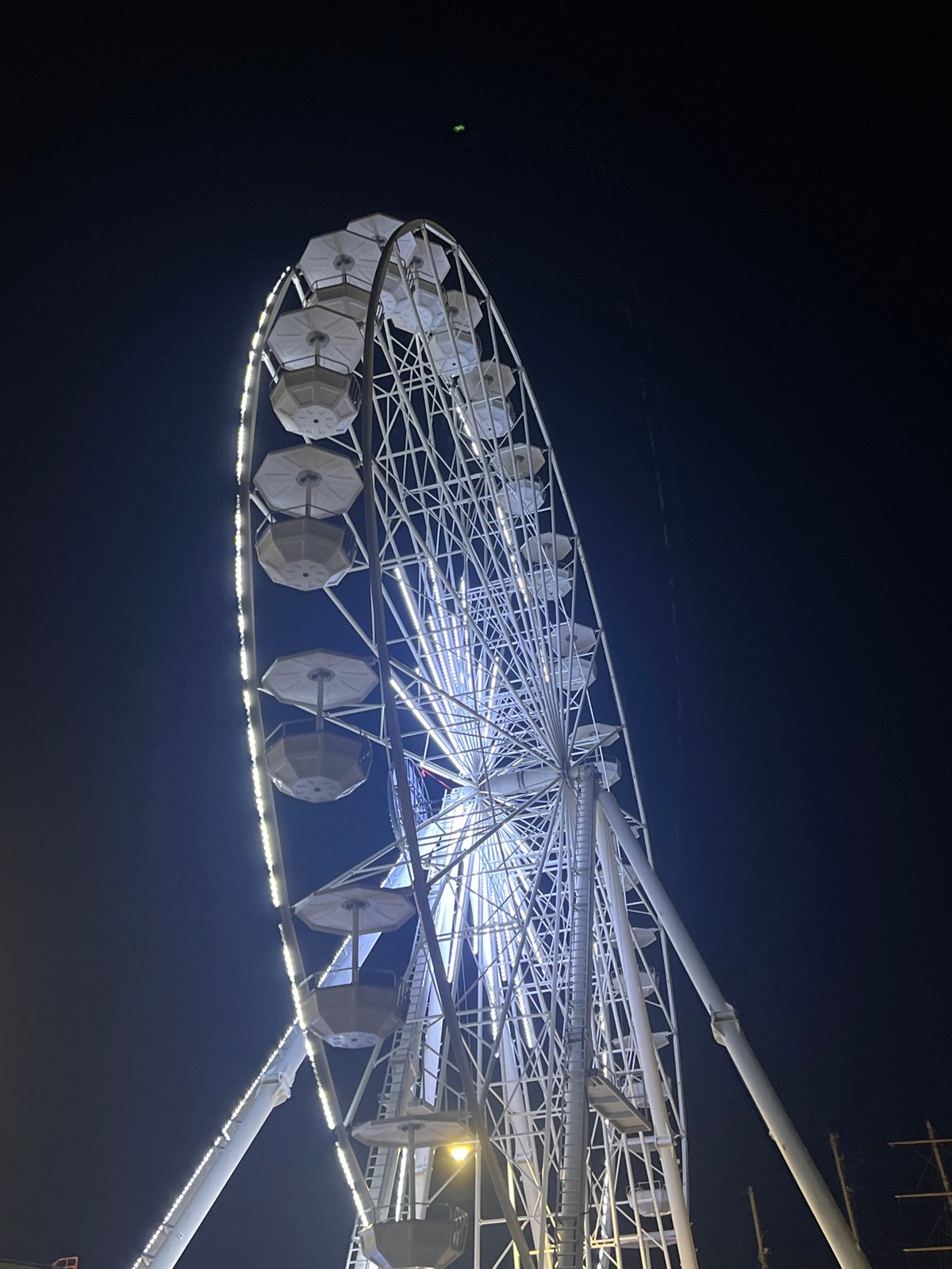 Illuminated amusement park rides operate in Varna, Bulgaria