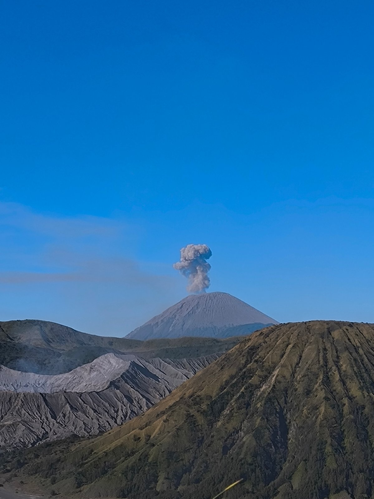 Mount Bromo erupting over the Tengger caldera plain