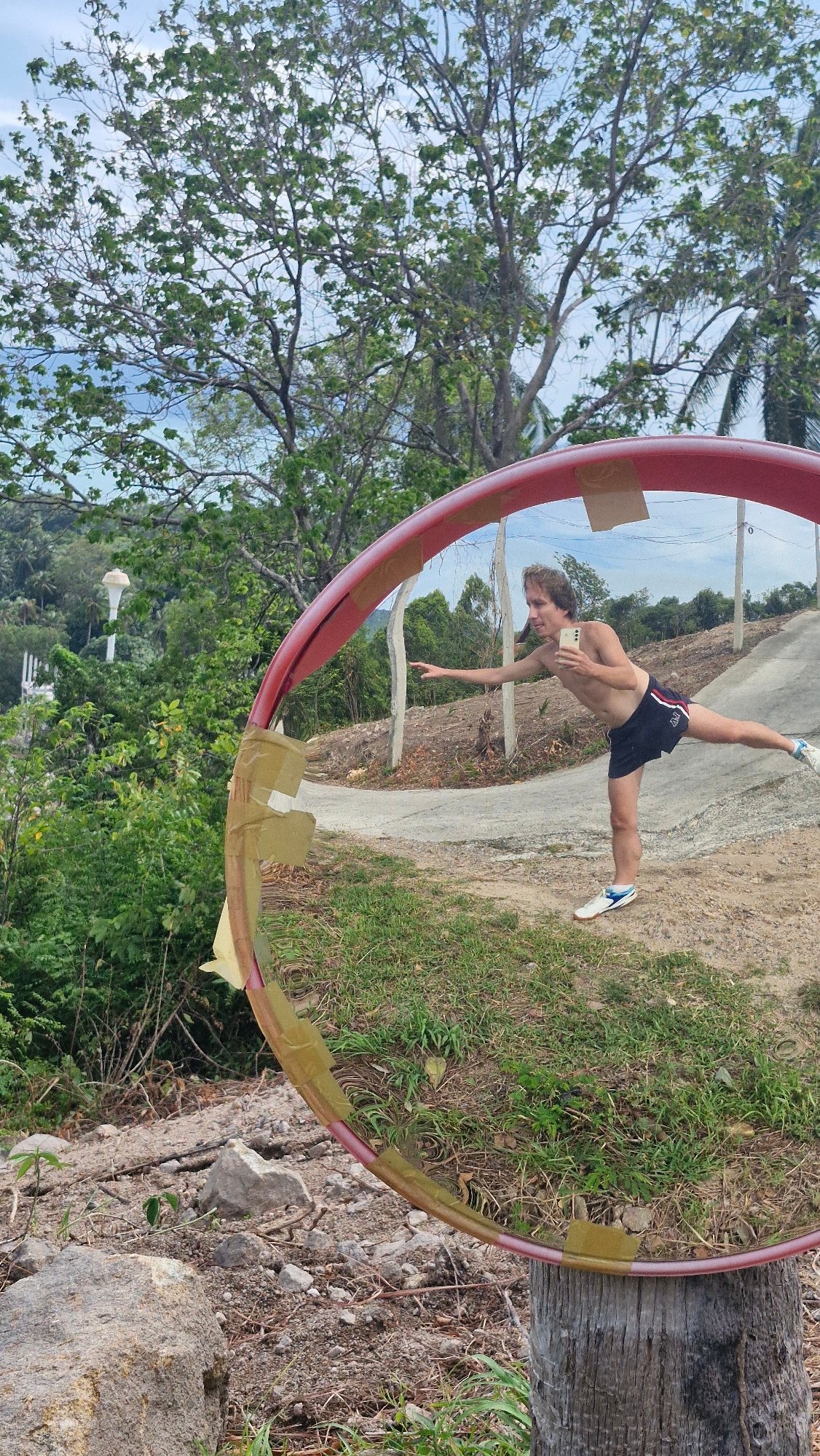 Selfie session at a roadside convex mirror in Ko Samui
