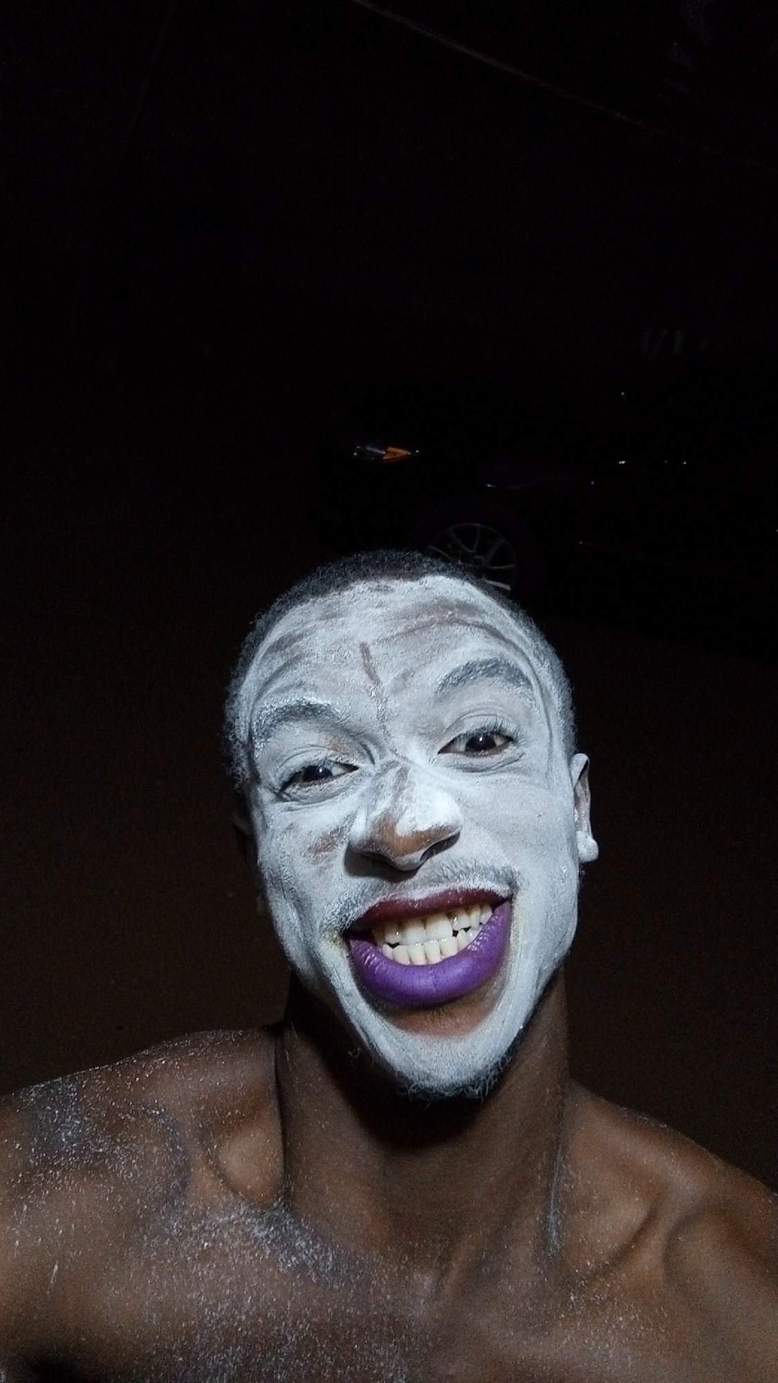 Person photographed with white body paint in Onitsha, Nigeria